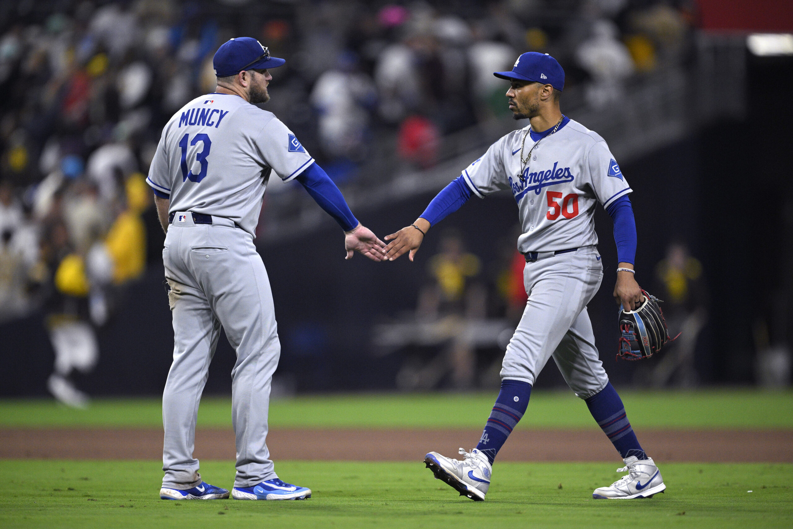 Dodgers third baseman Max Muncy, left, and shortstop Mookie Betts...