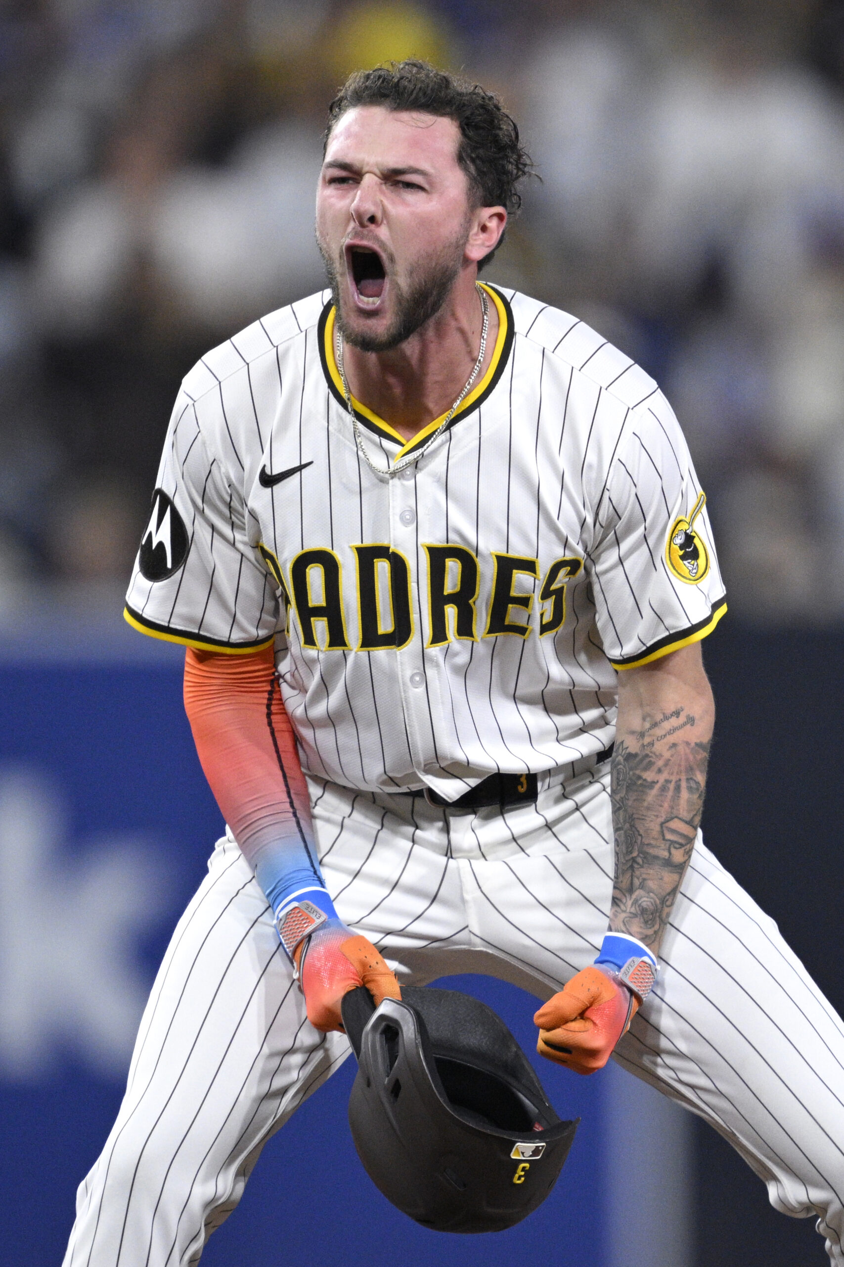 The San Diego Padres’ Jackson Merrill celebrates after hitting an...