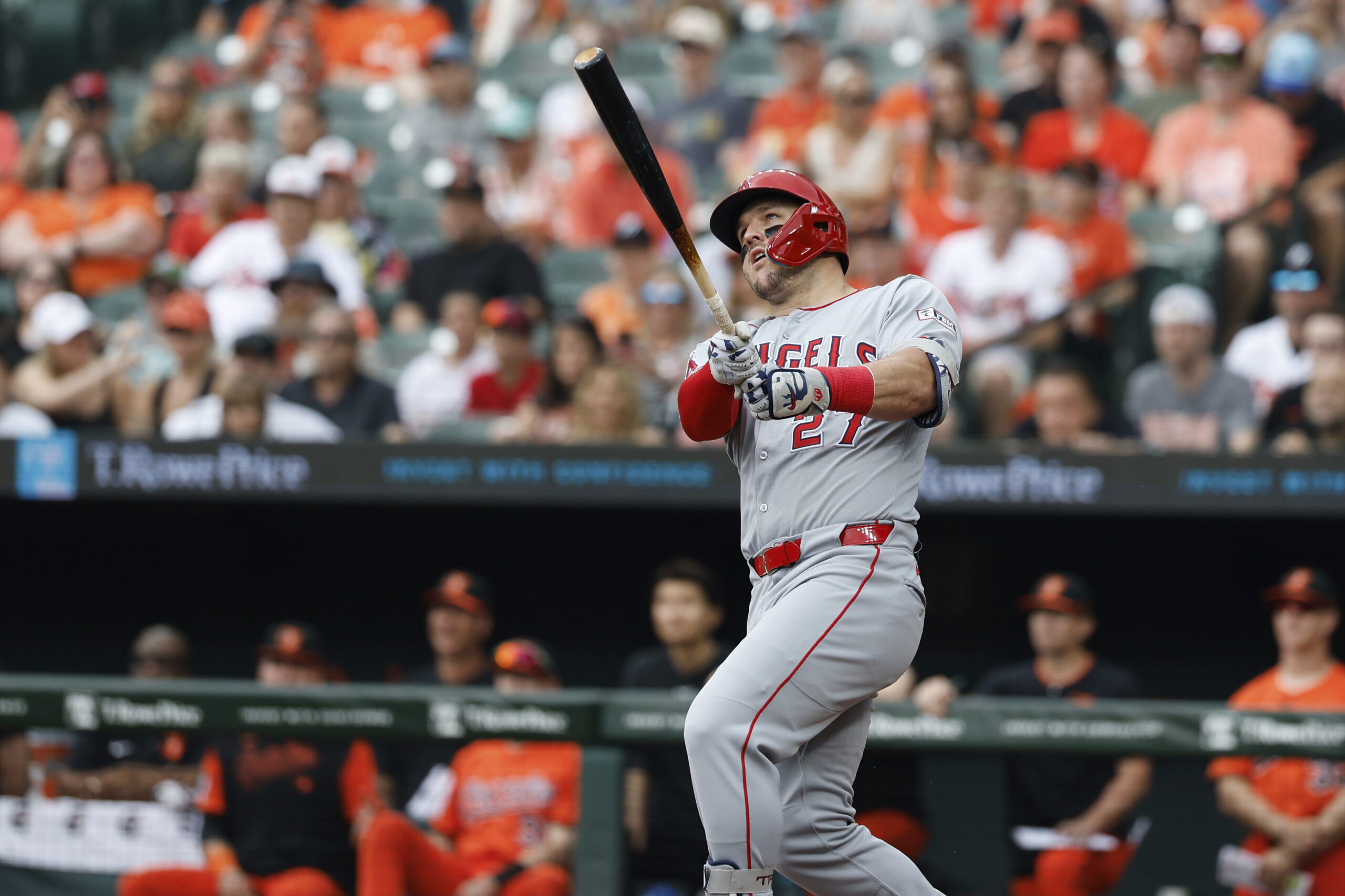 Angels’ Mike Trout (27) follows through on his swing after...