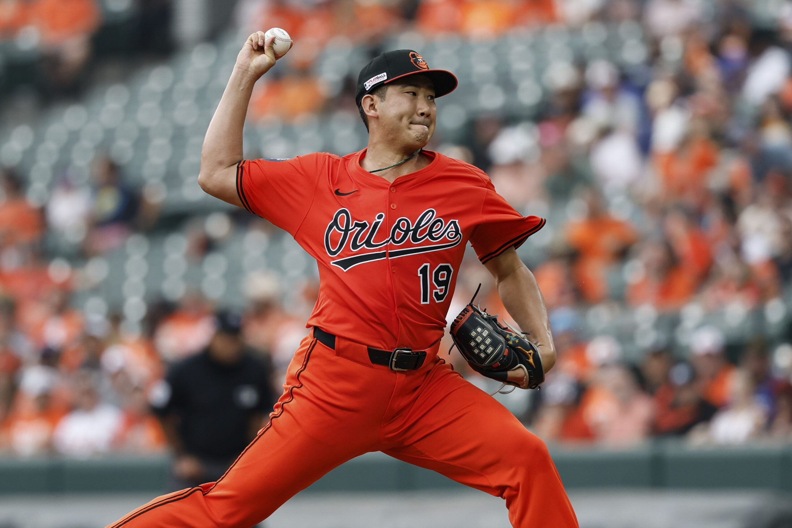 Baltimore Orioles pitcher Tomoyuki Sugano (19) throws during the first...