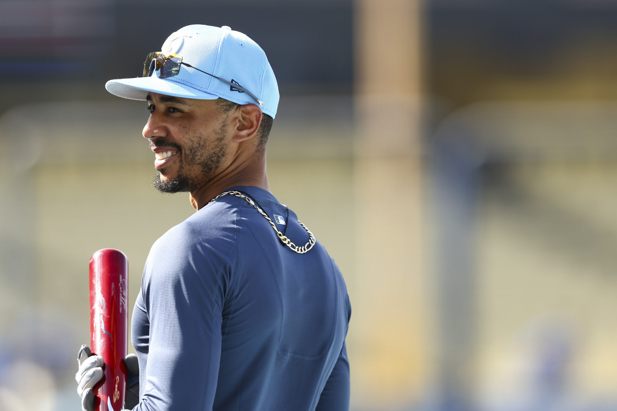 Dodgers’ Mookie Betts reacts during batting practice before a baseball...