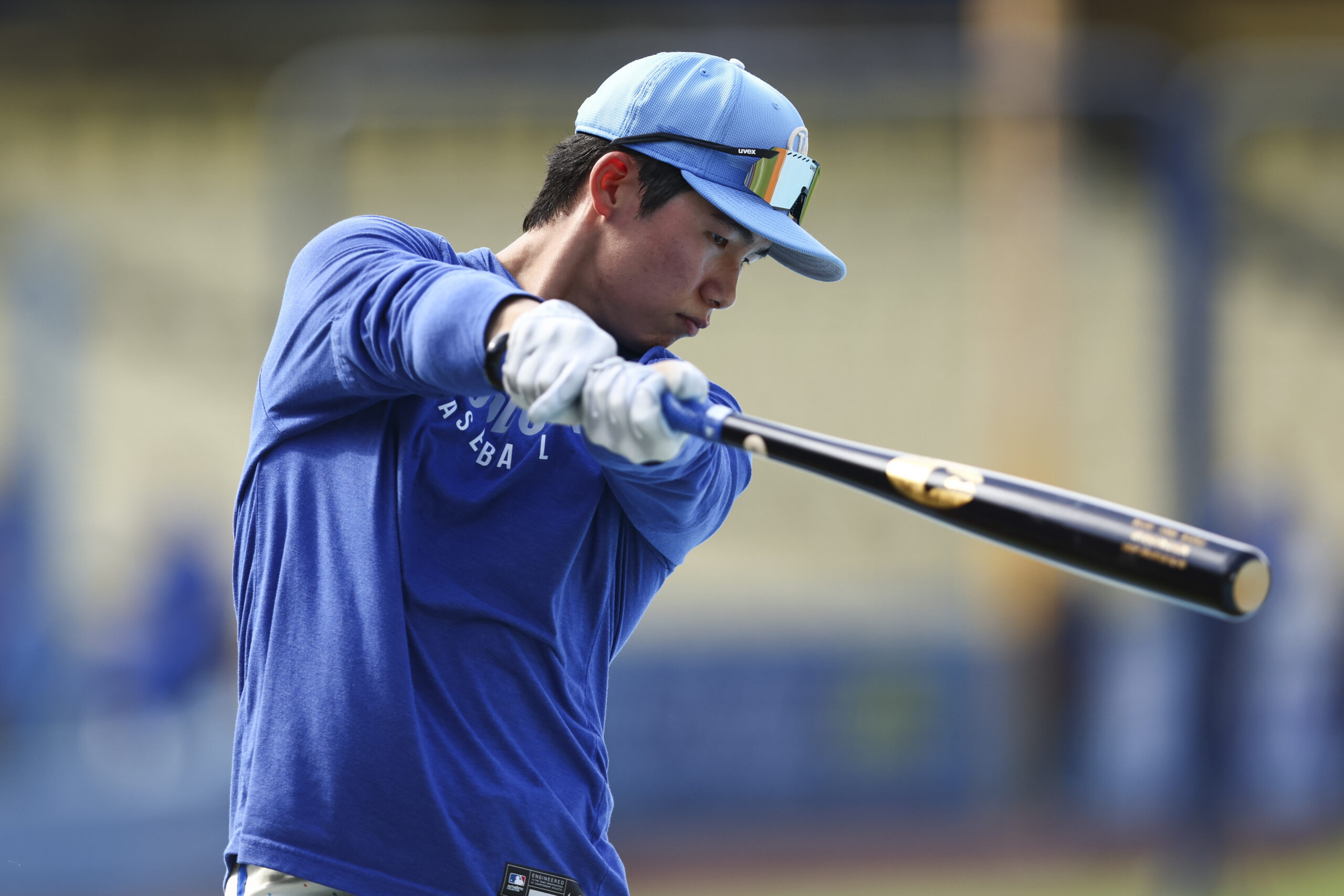 Dodgers’ Hyeseong Kim swings during batting practice before a baseball...