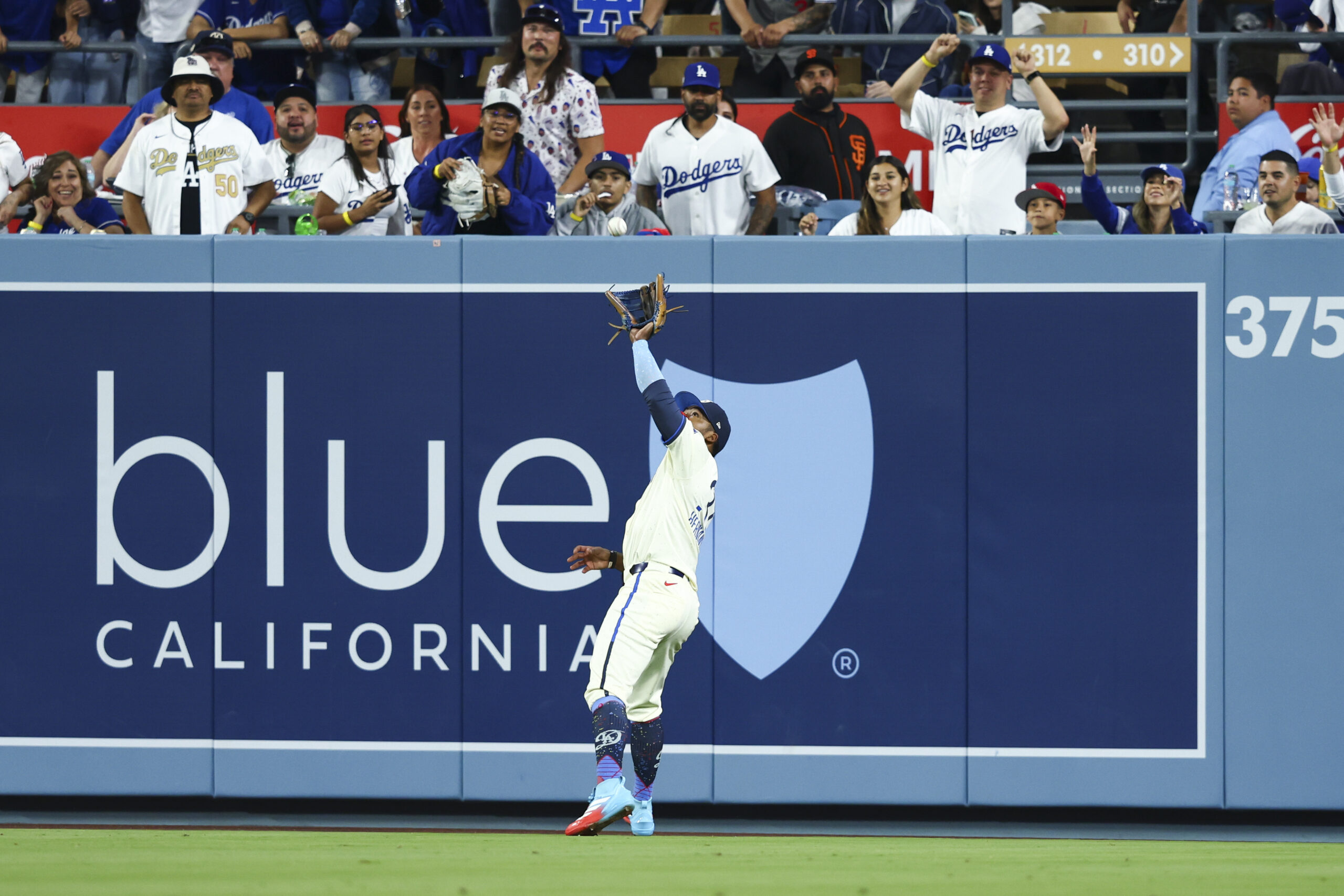 Dodgers right fielder Teoscar Hernández makes a catch during the...