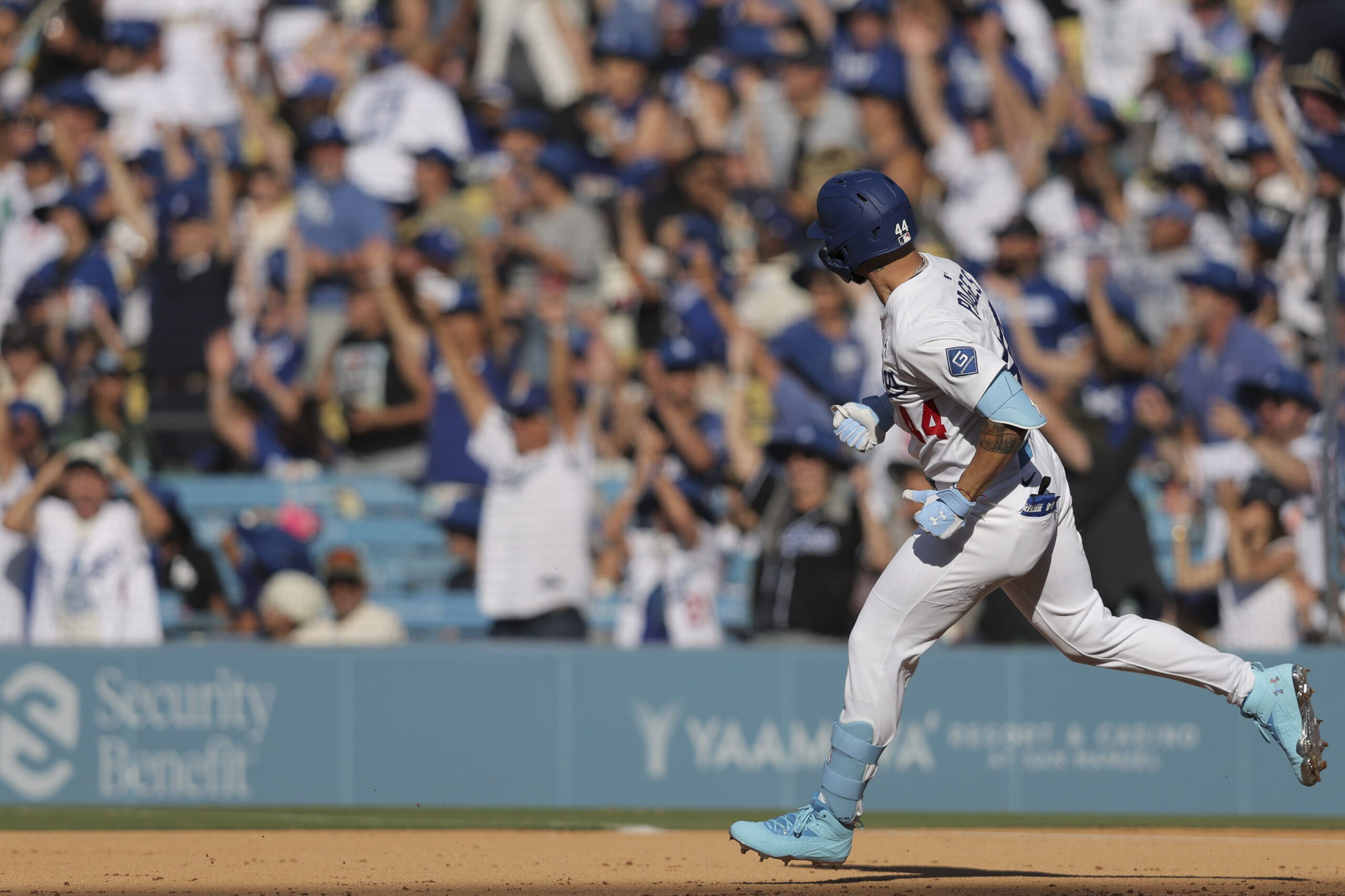 Dodgers’ Andy Pages runs the bases after hitting a home...