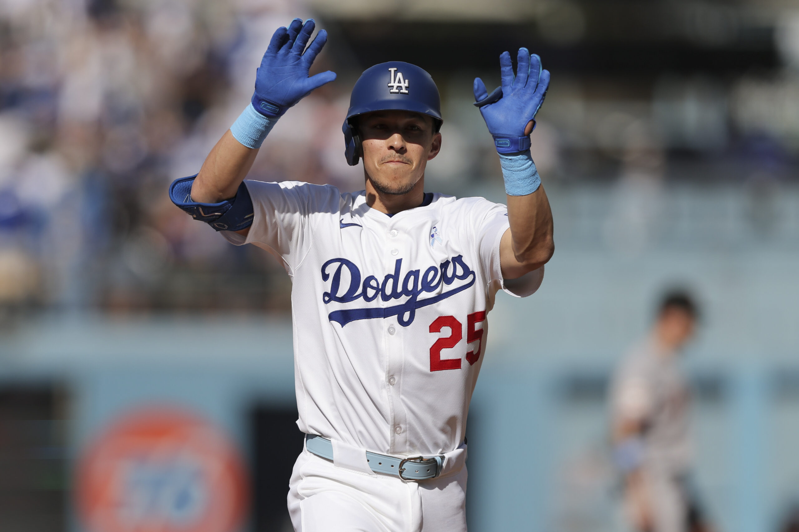 Dodgers’ Tommy Edman (25) gestures after hitting a home run...