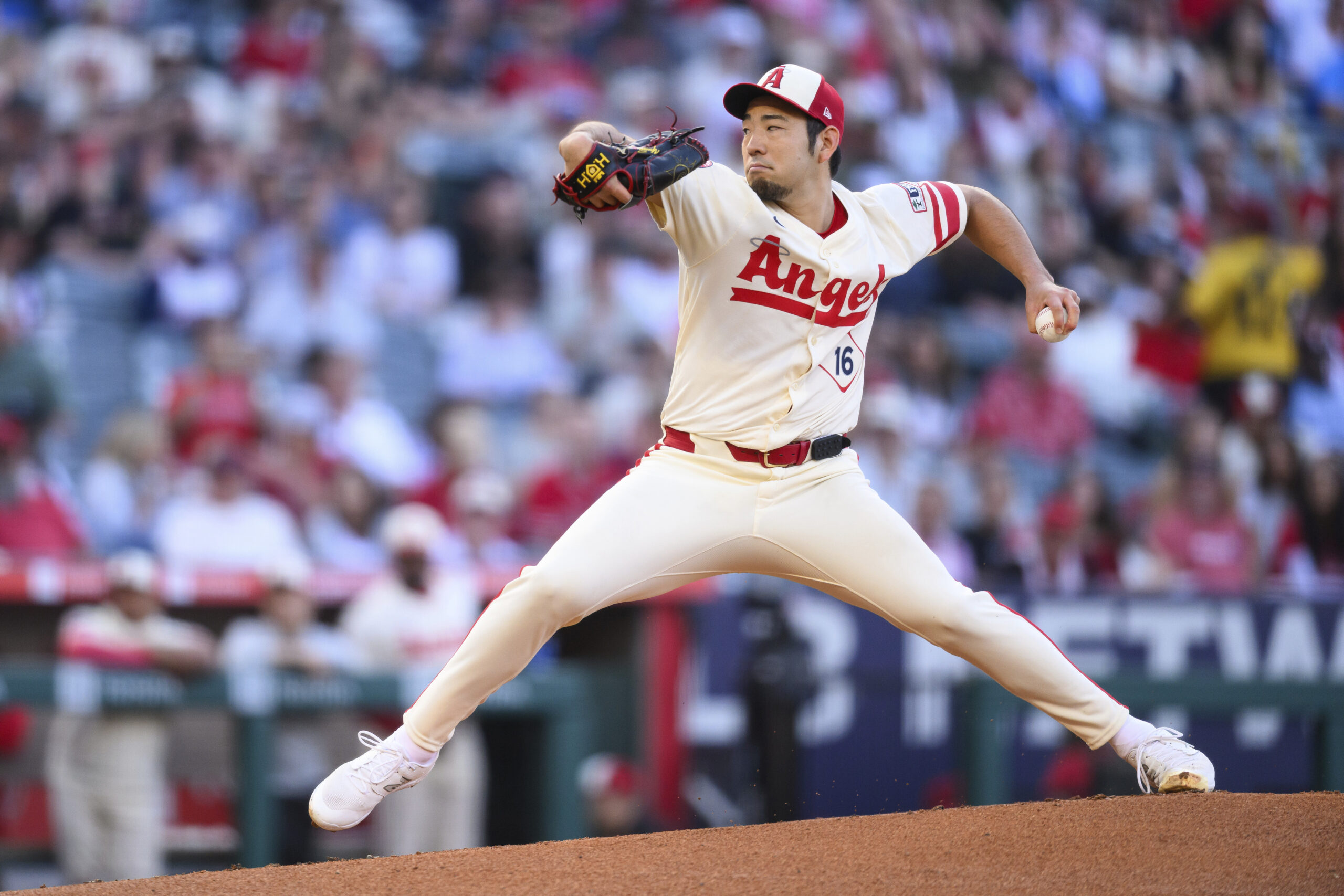 Angels starting pitcher Yusei Kikuchi throws to the plate during...