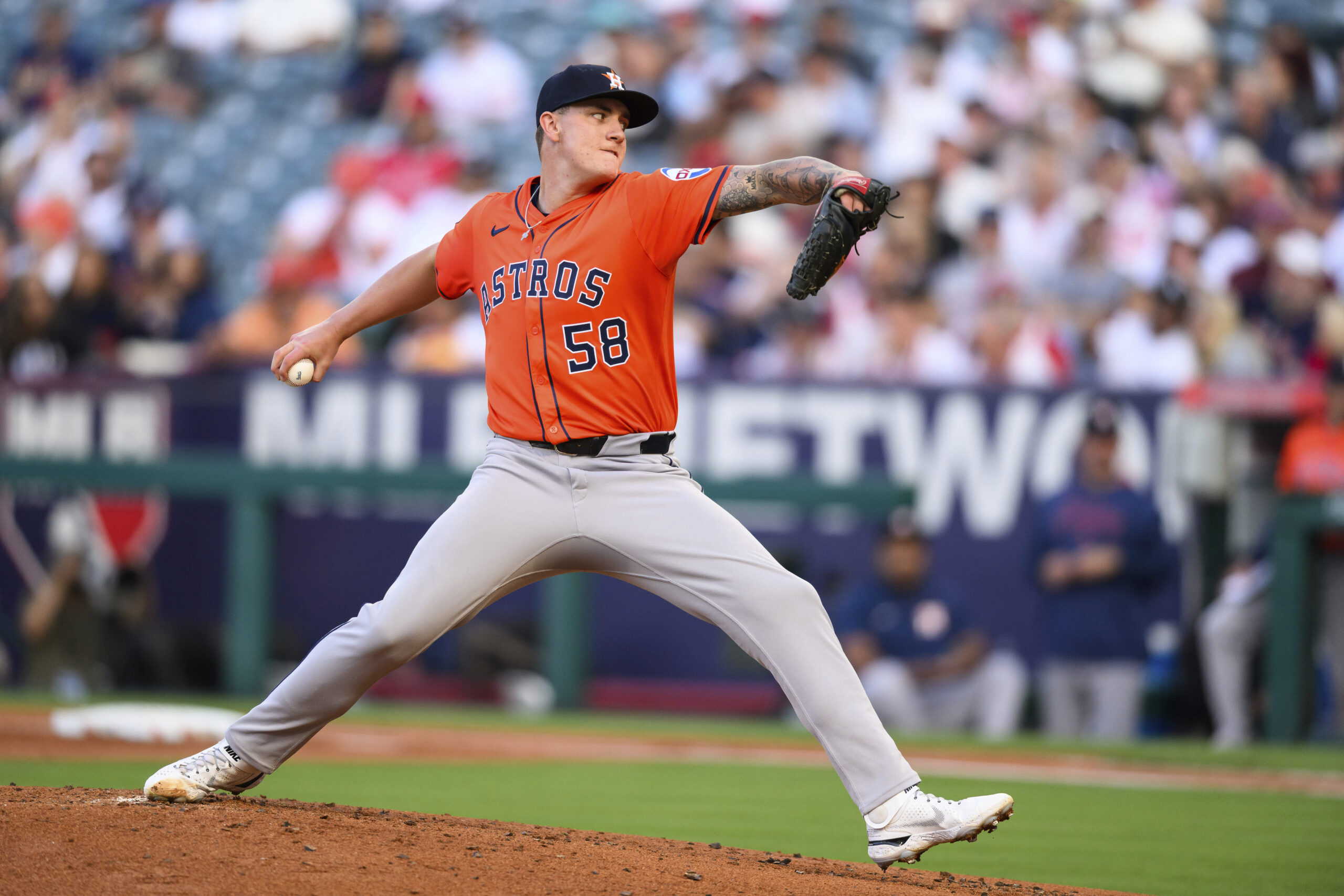 Houston Astros starting pitcher Hunter Brown throws to the plate...
