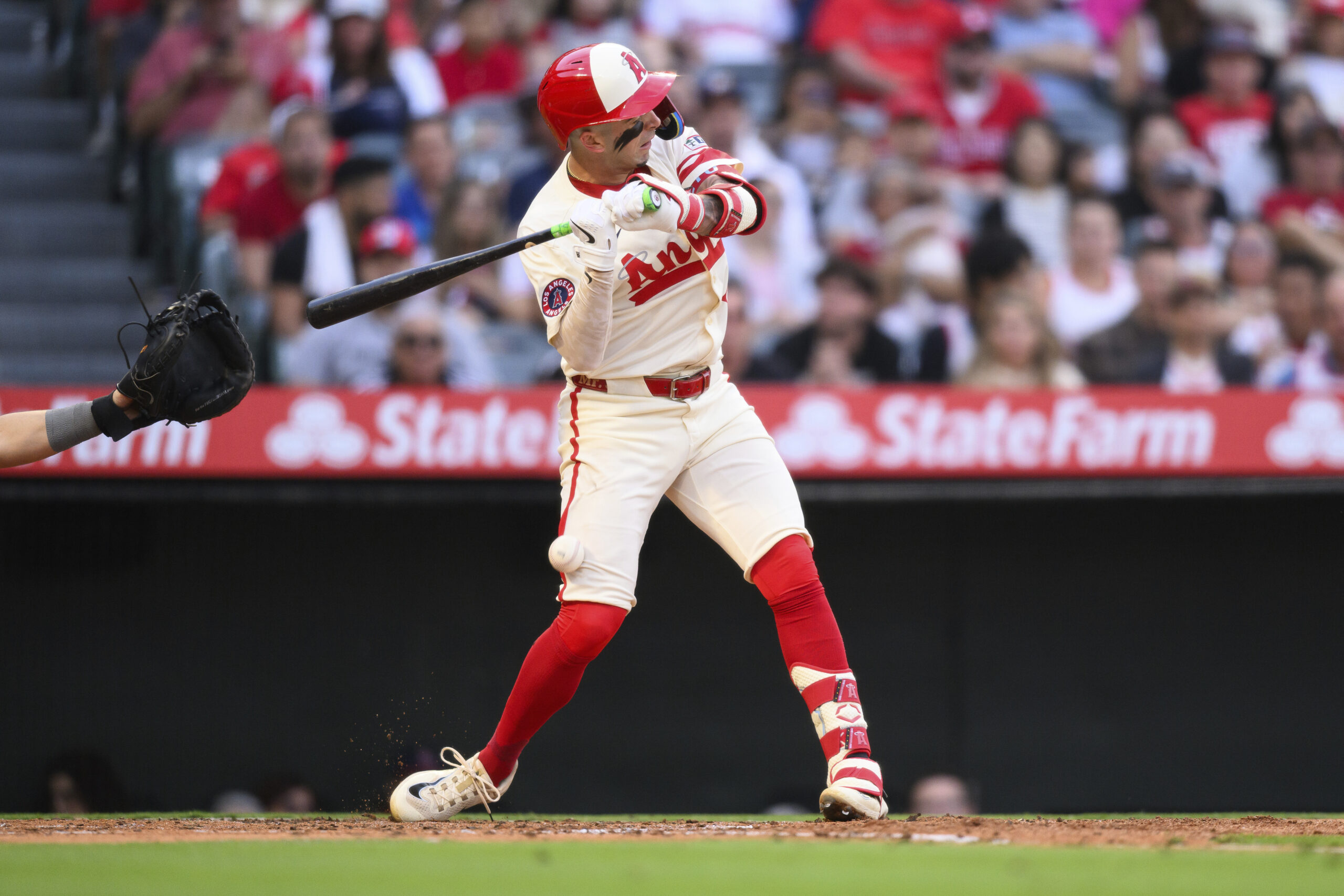 The Angels’ Zach Neto is hit by a pitch during...