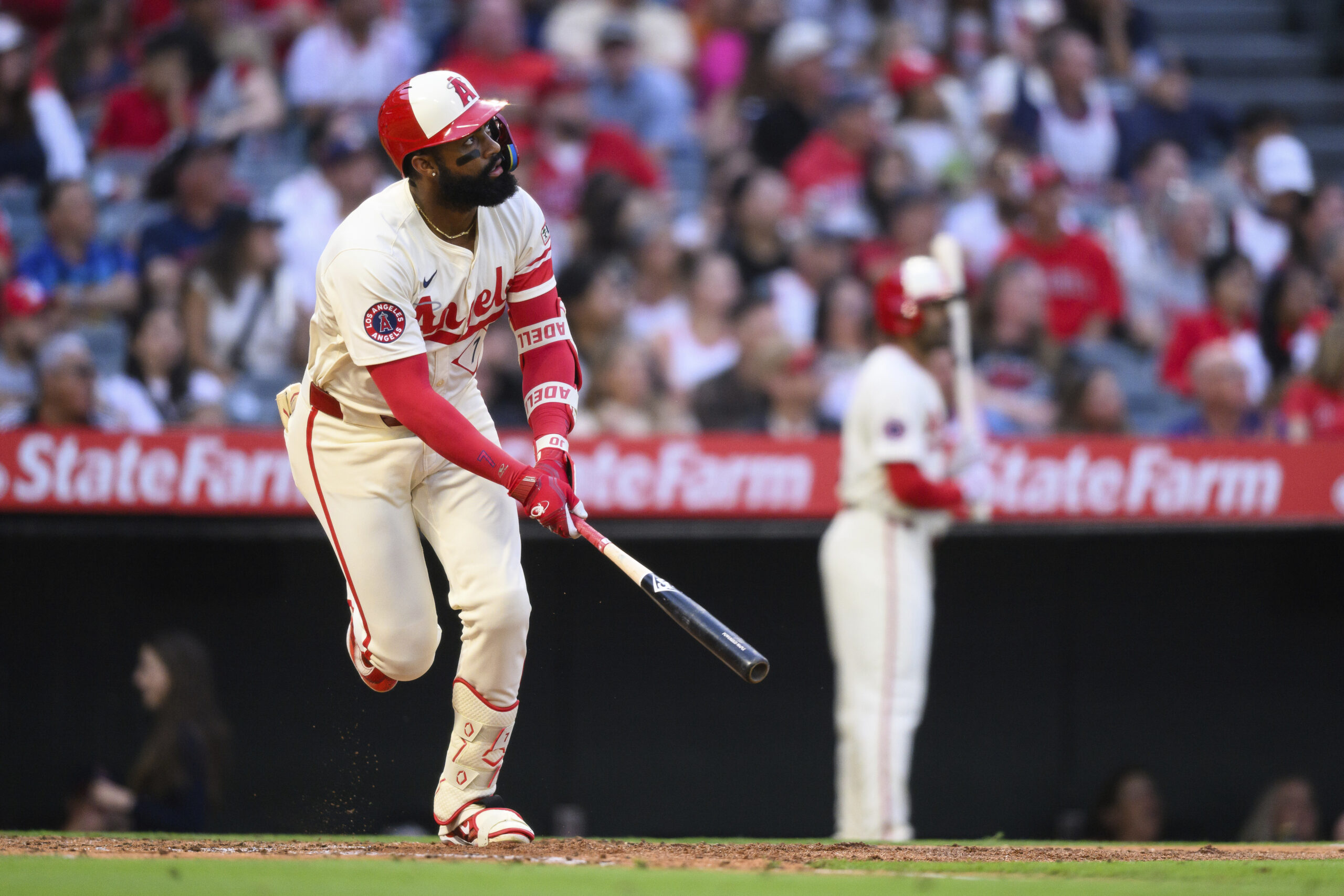 The Angels’ Jo Adell watches the flight of his home...