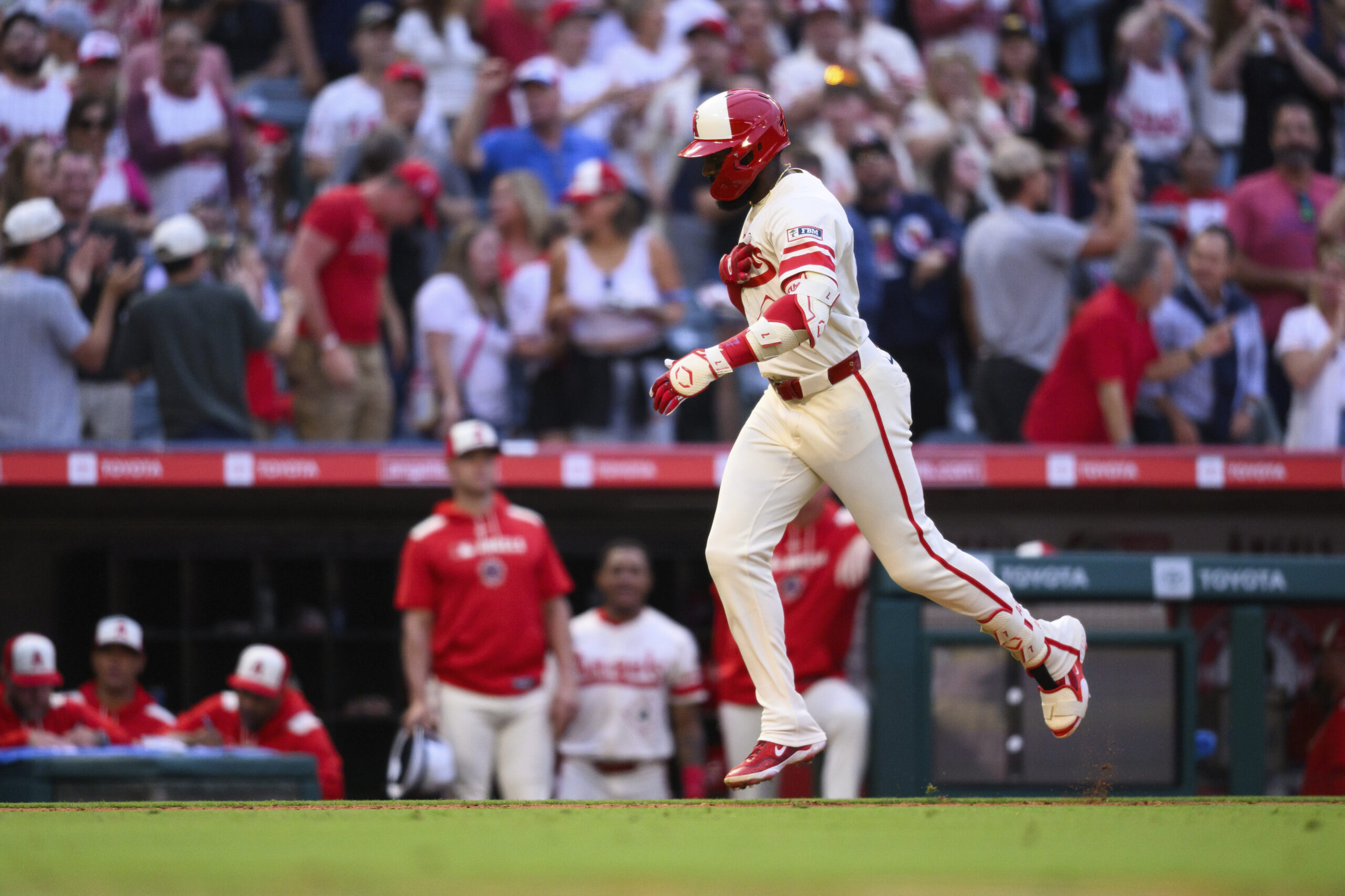 The Angels’ Jo Adell gestures as he runs the bases...