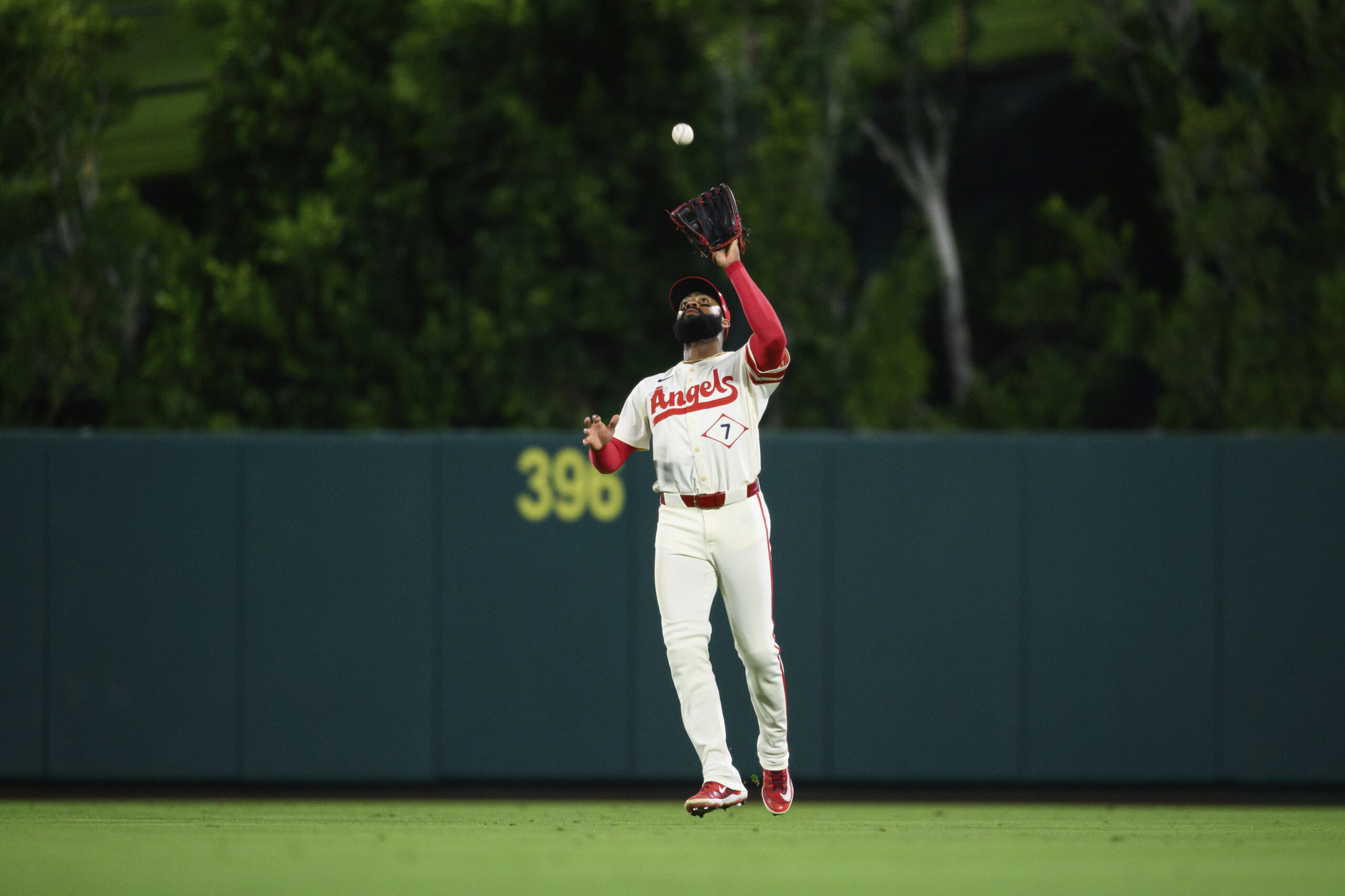 Angels center fielder Jo Adell makes a catch during the...