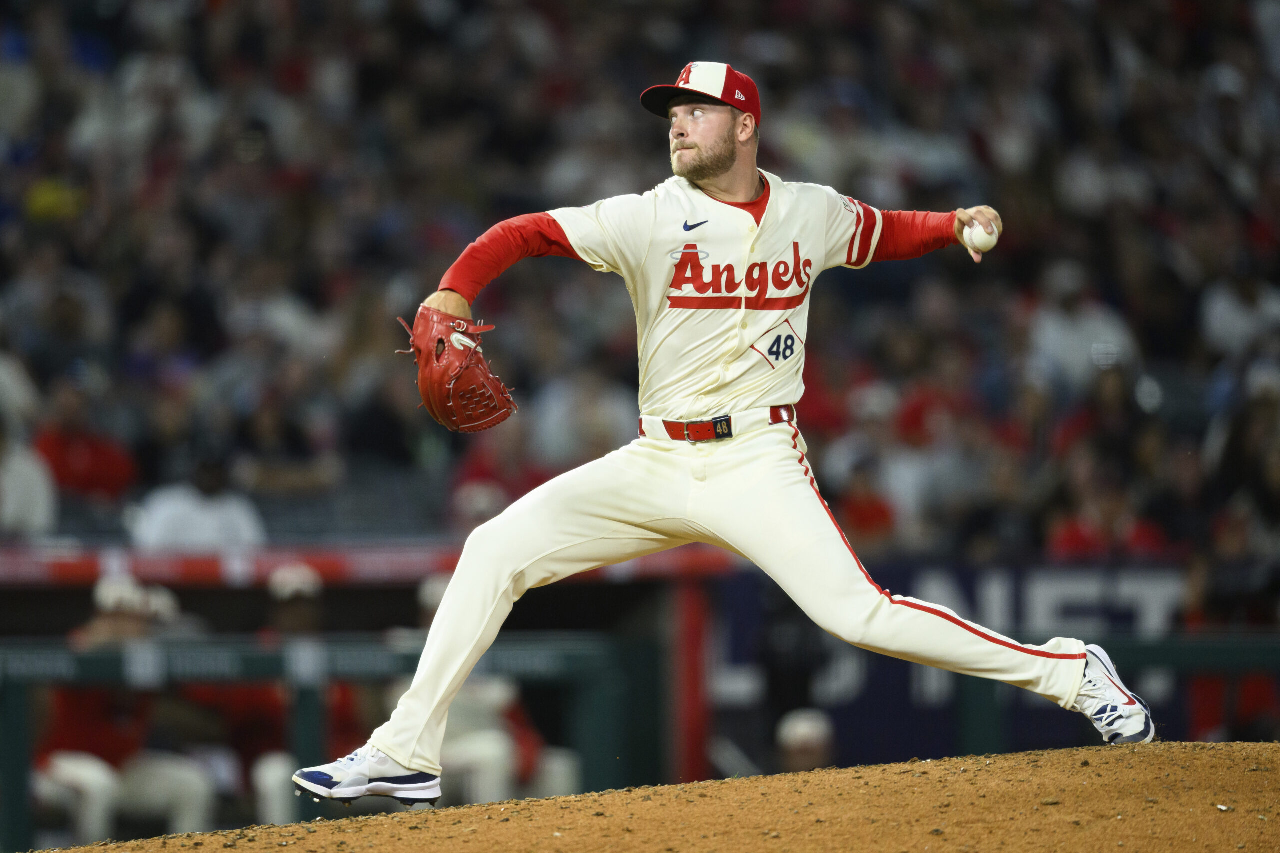 Angels relief pitcher Reid Detmers throws to the plate during...