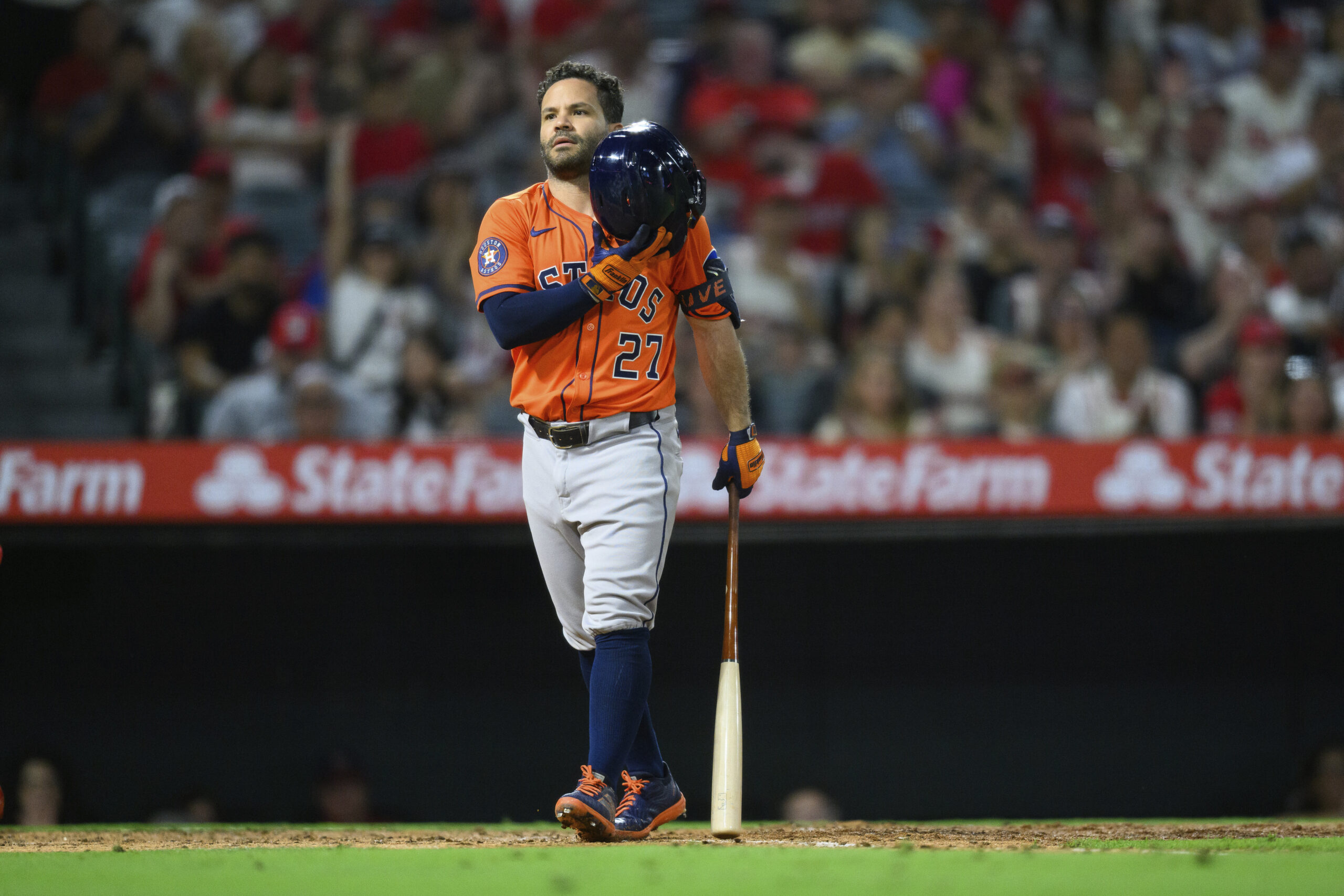 The Houston Astros’ Jose Altuve reacts after striking out during...