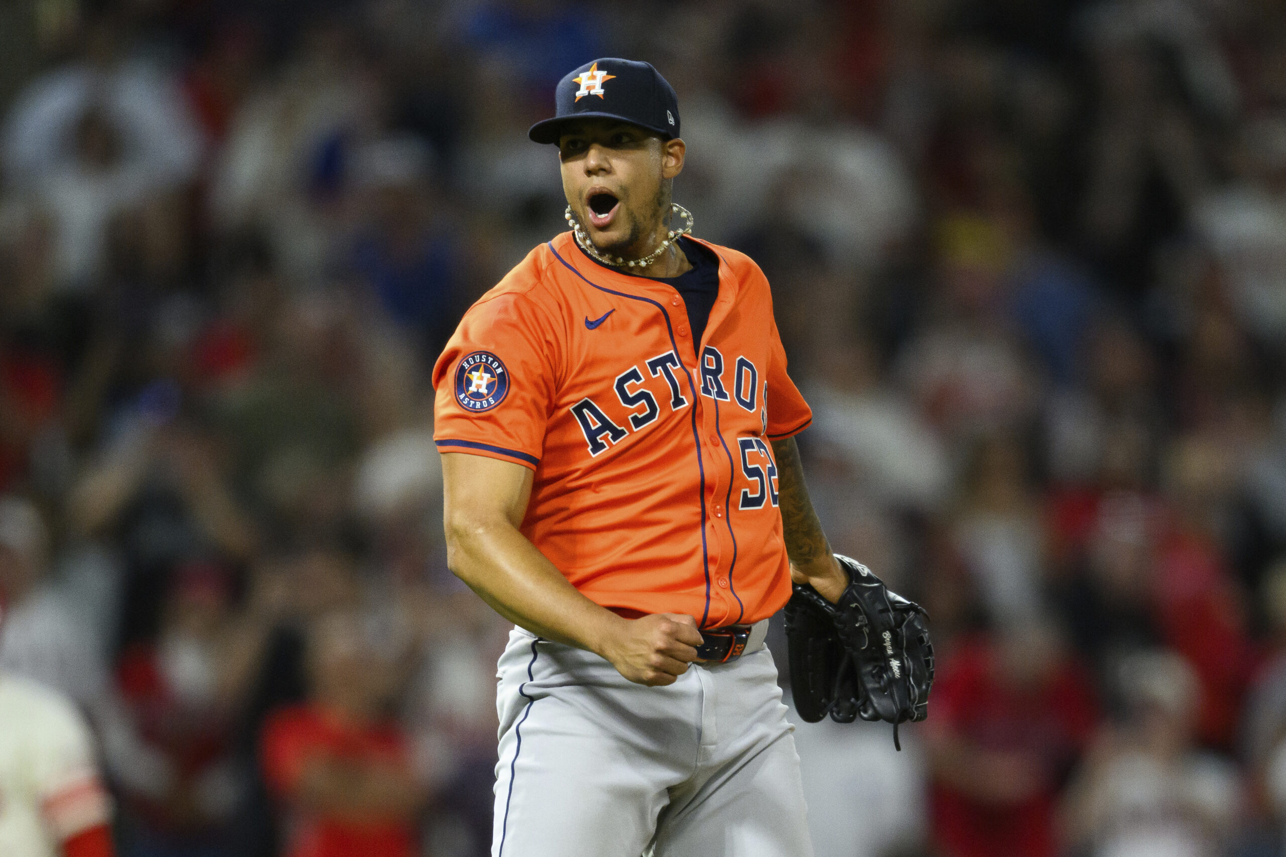 Houston Astros relief pitcher Bryan Abreu reacts after striking out...