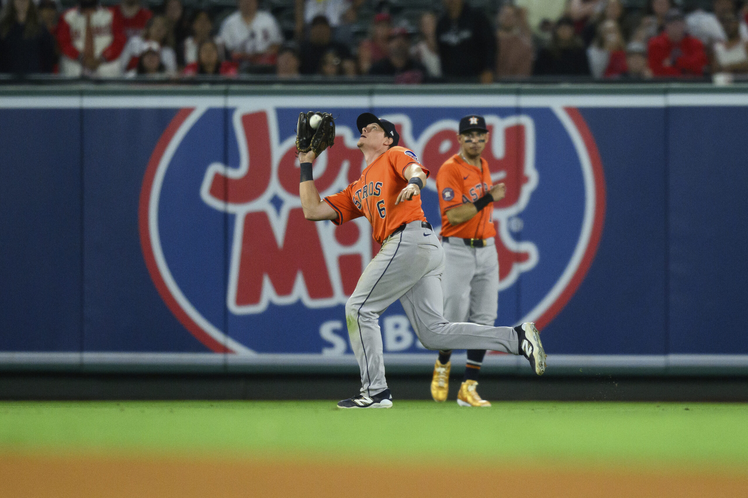Houston Astros center fielder Jake Meyers, left, makes a catch...