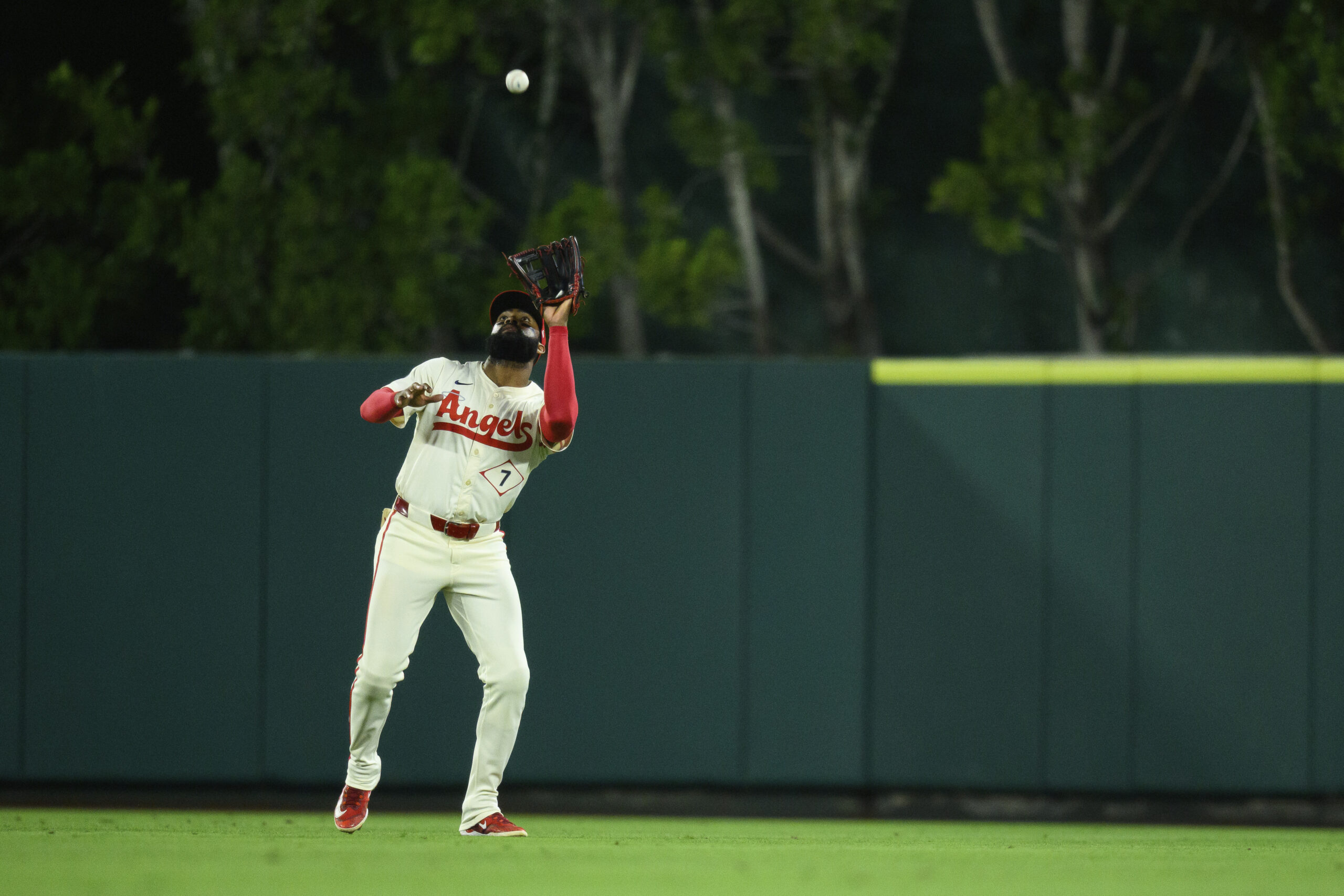 Angels center fielder Jo Adell makes a catch during the...