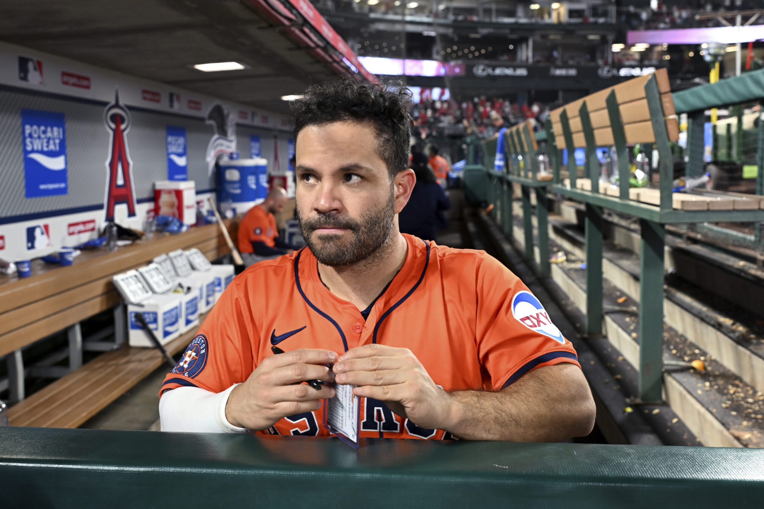 Houston Astros Jose Altuve (27) signs autographs after losing to...