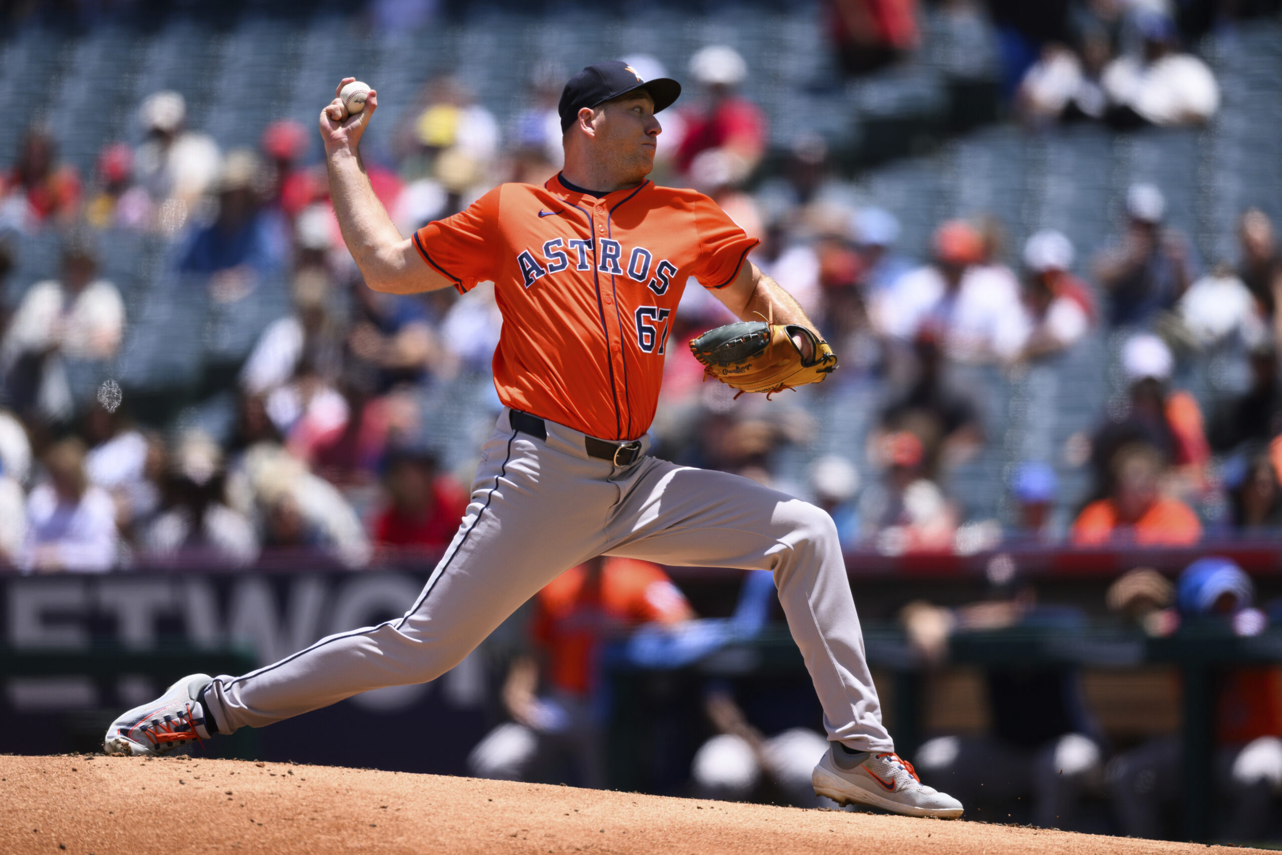 Houston Astros pitcher Ryan Gusto delivers a pitch during the...