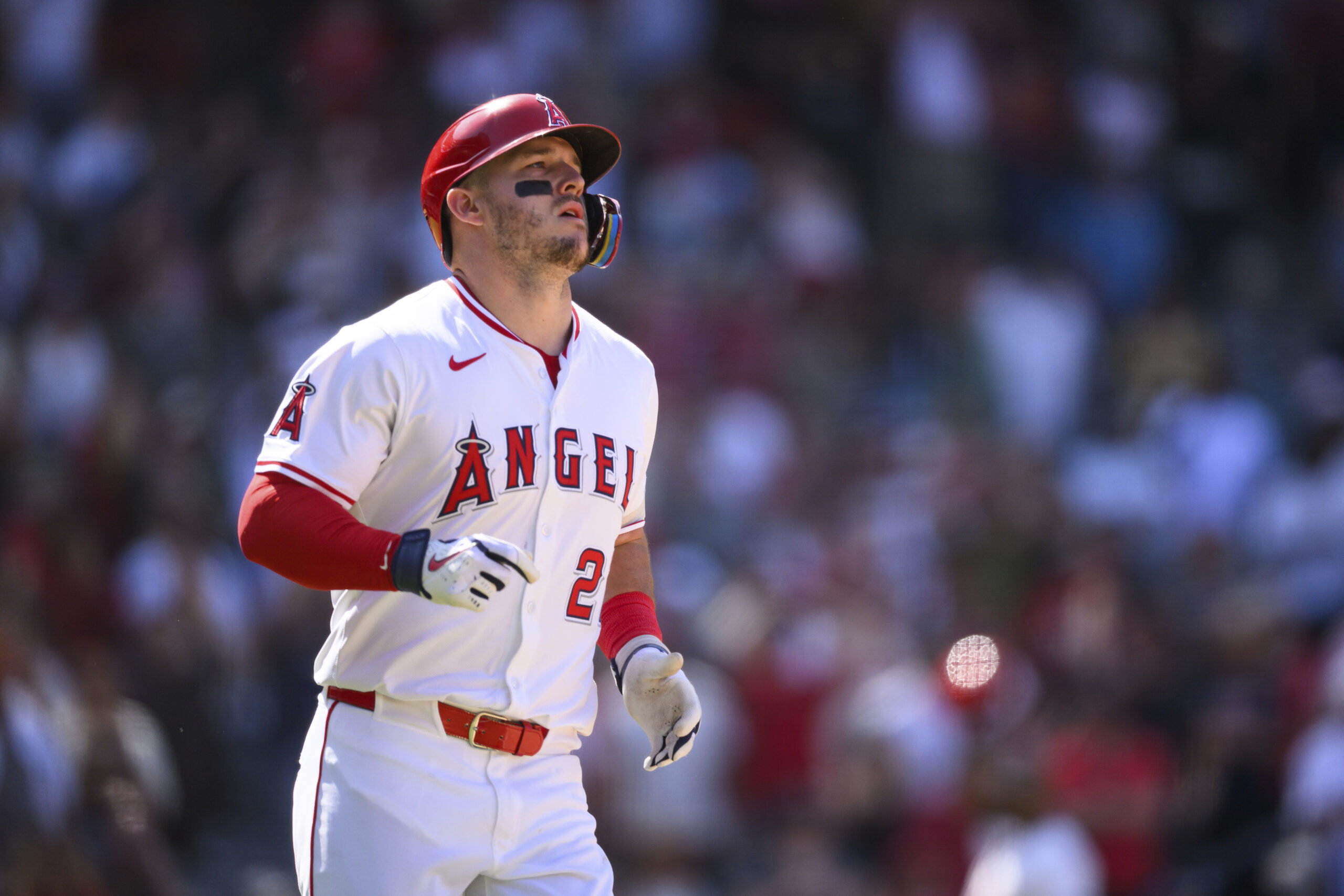 Angels’ Mike Trout reacts after hitting a fly ball to...