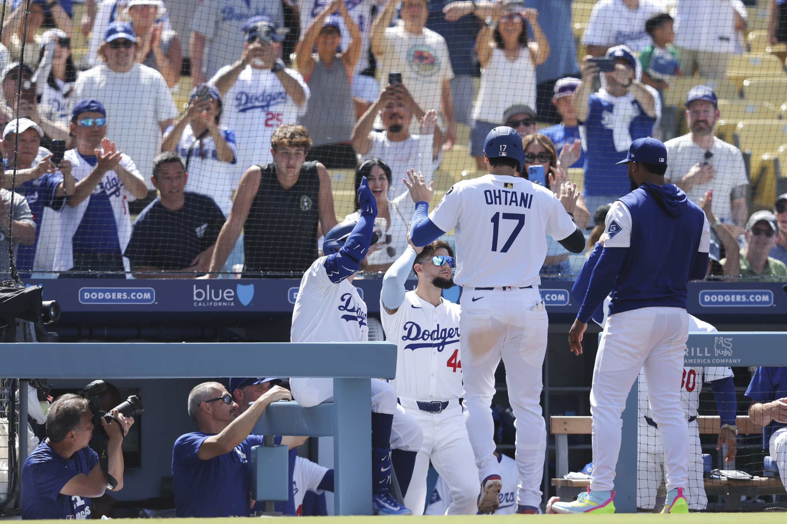 Dodgers’ Shohei Ohtani (17) celebrates with Andy Pages and additional...