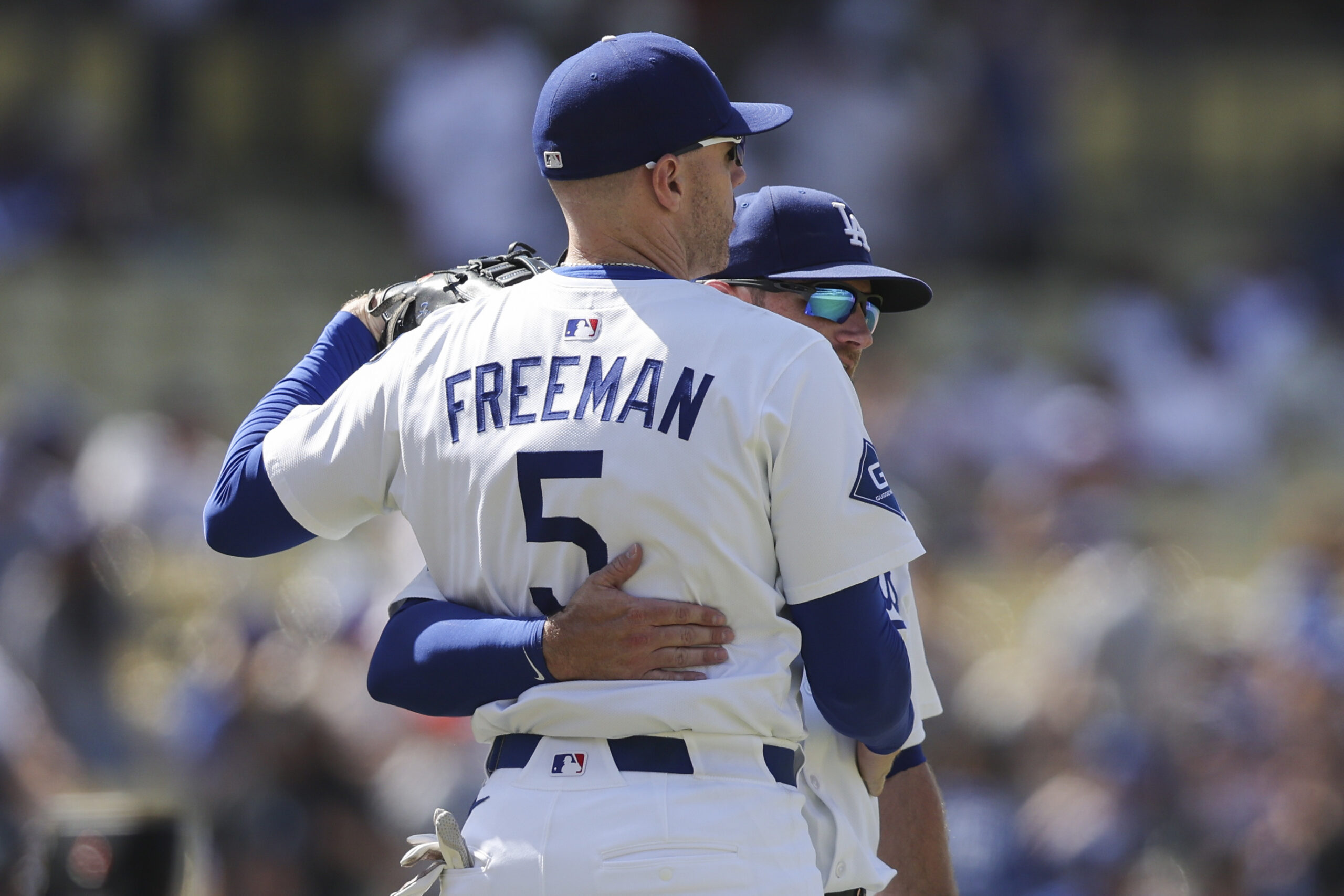 Dodgers first baseman Freddie Freeman (5) and third baseman Max...