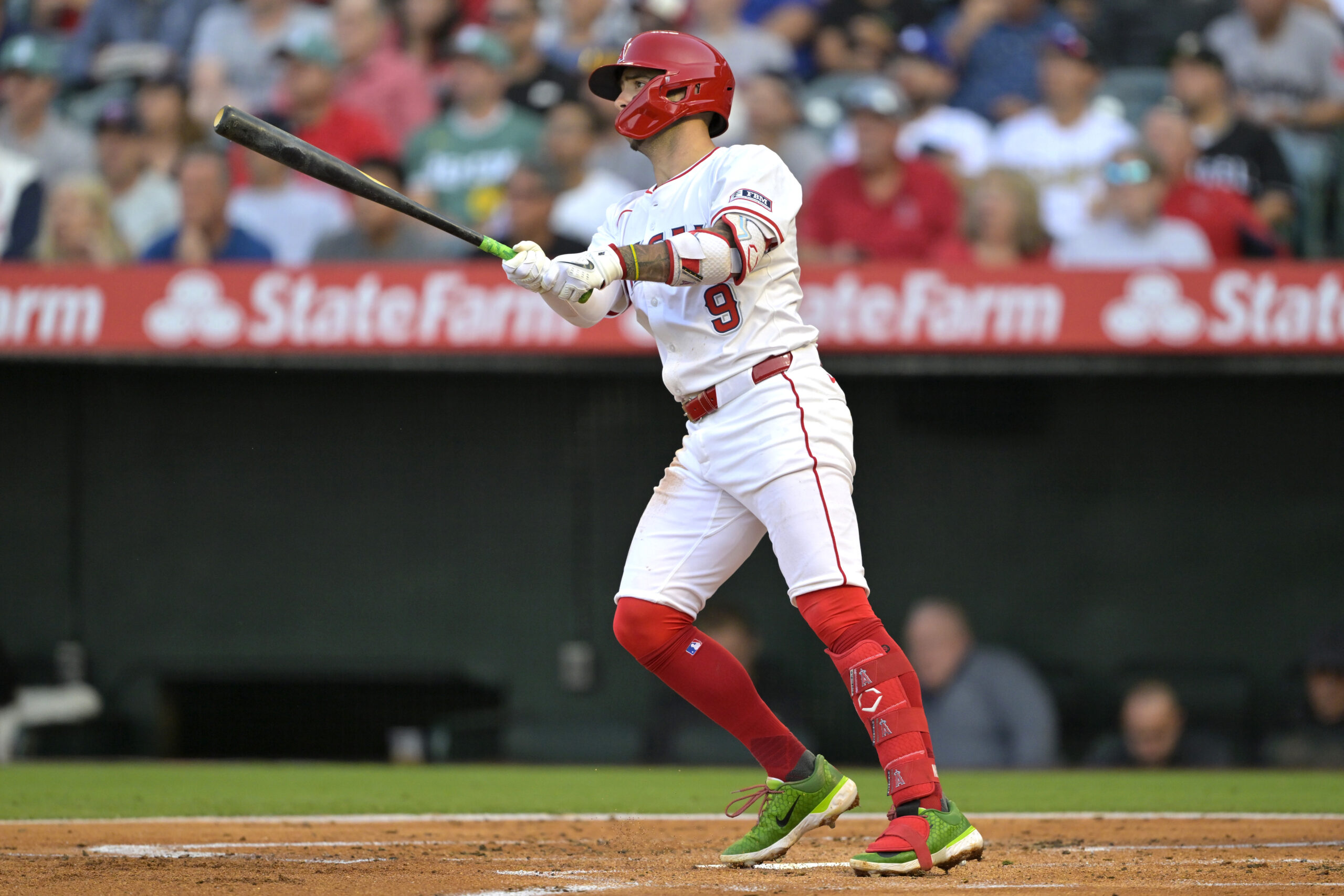 The Angels’ Zach Neto watches the flight of his solo...