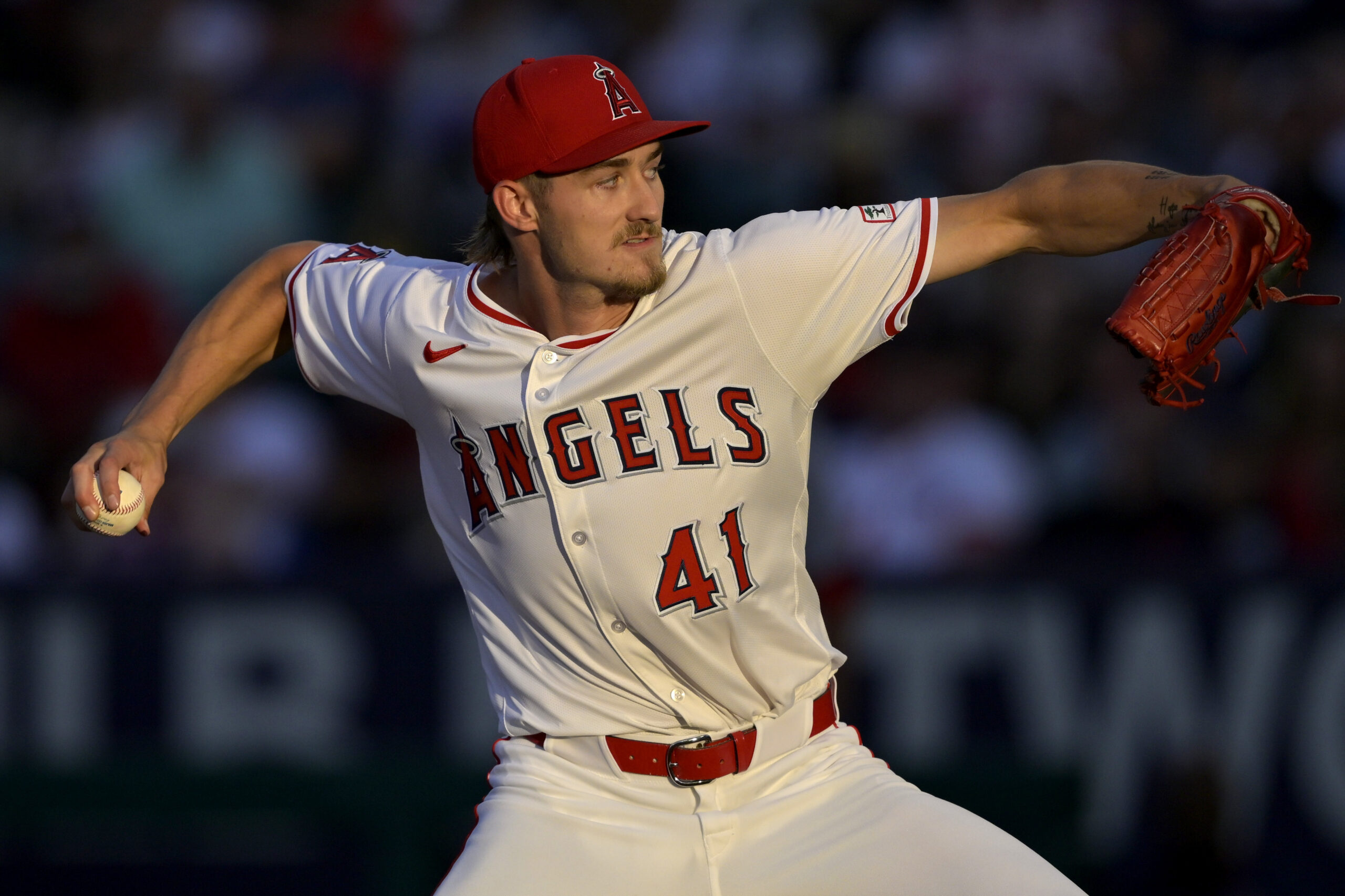 Angels starting pitcher Jack Kochanowicz throws to the plate during...
