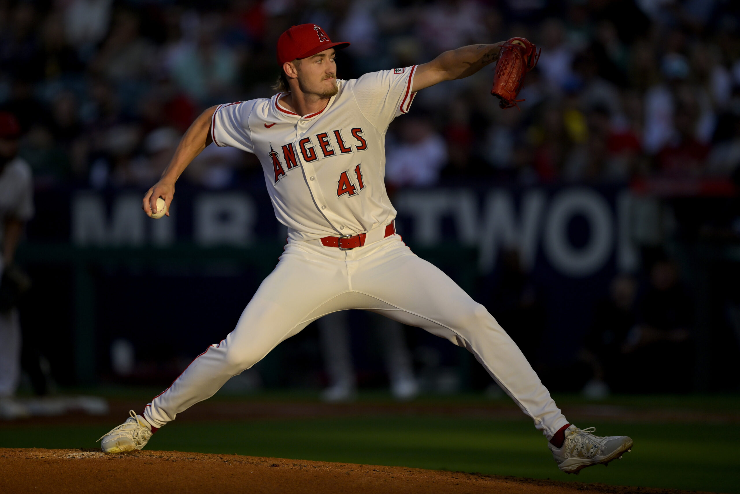 Angels starting pitcher Jack Kochanowicz throws to the plate during...
