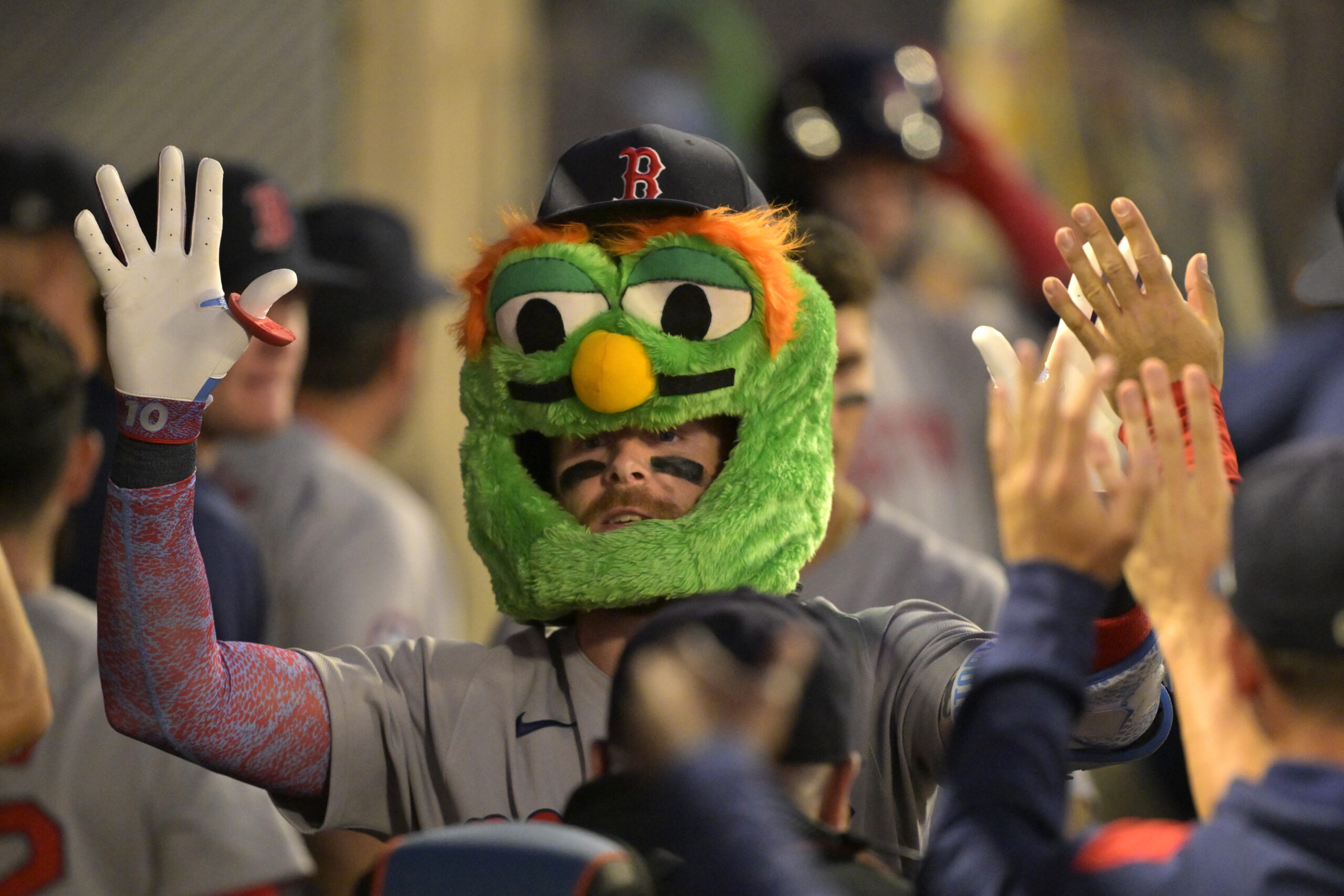 The Boston Red Sox’s Trevor Story is congratulated in the...