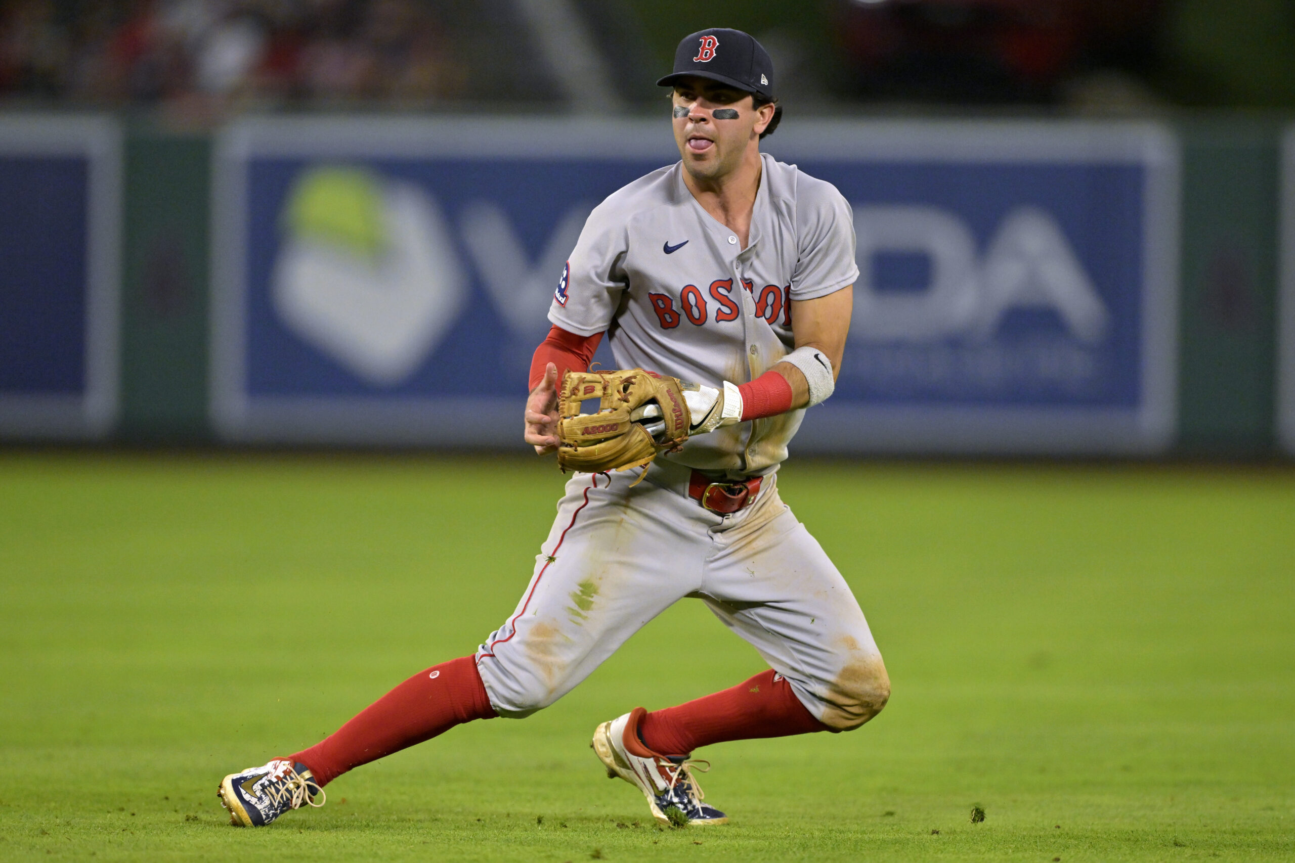 Boston Red Sox second baseman Marcelo Mayer can’t make a...