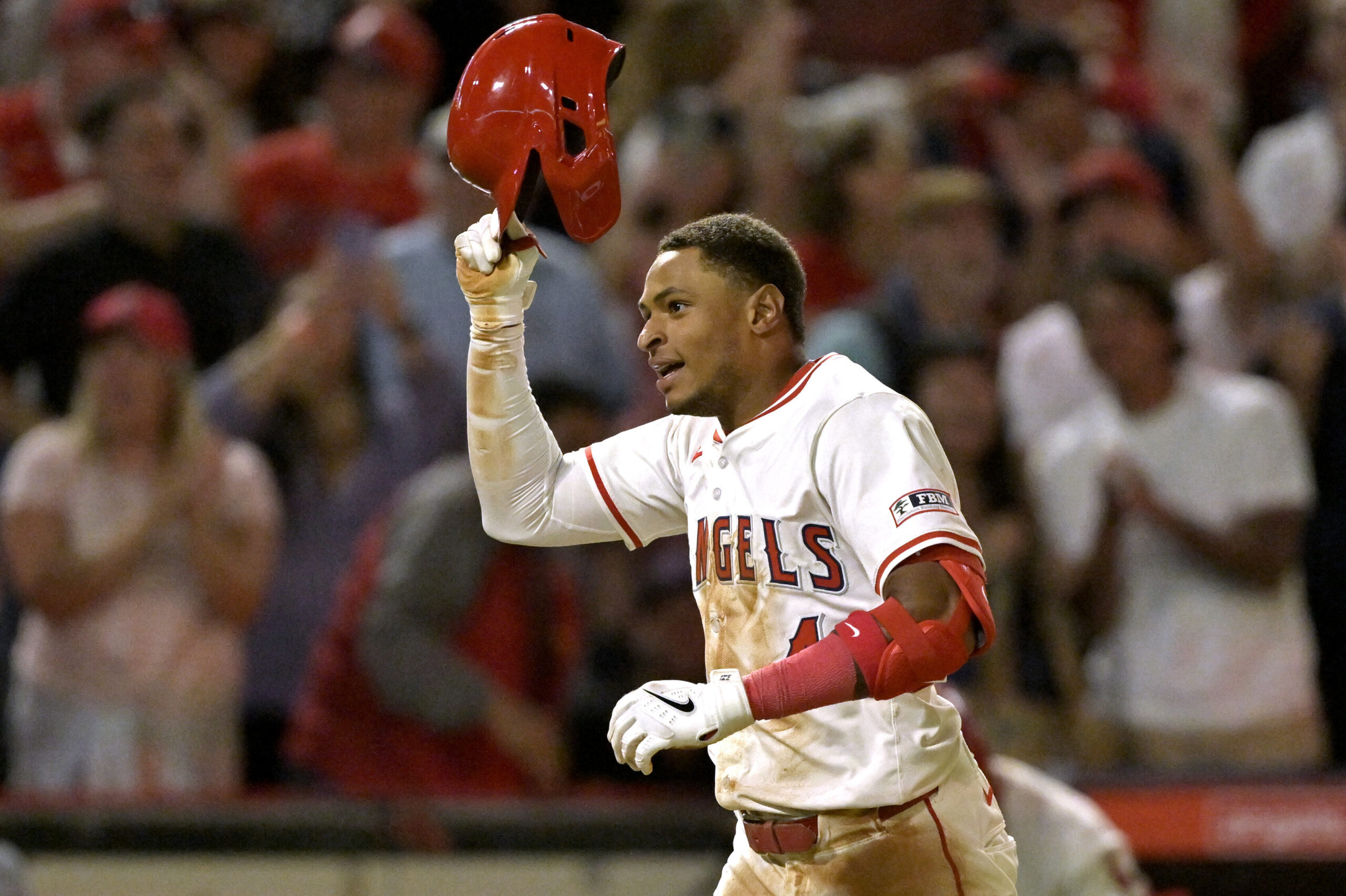 The Angels’ Christian Moore celebrates after hitting a two-run, walk-off...