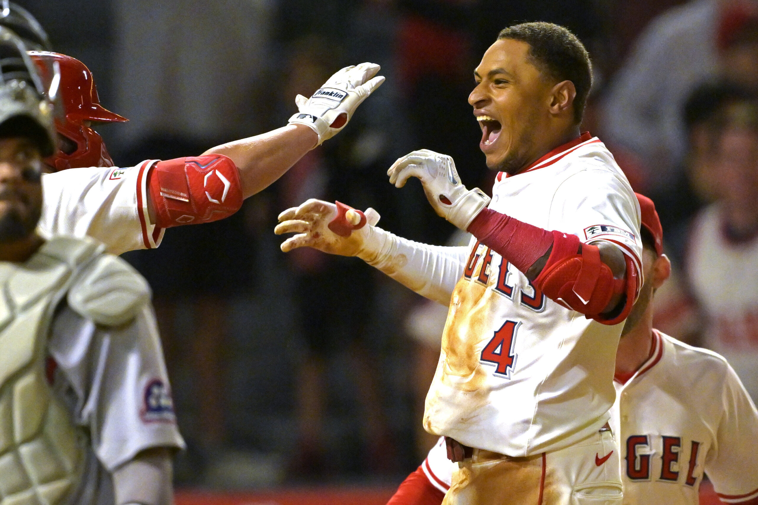 The Angels’ Christian Moore, right, celebrates after hitting a two-run,...