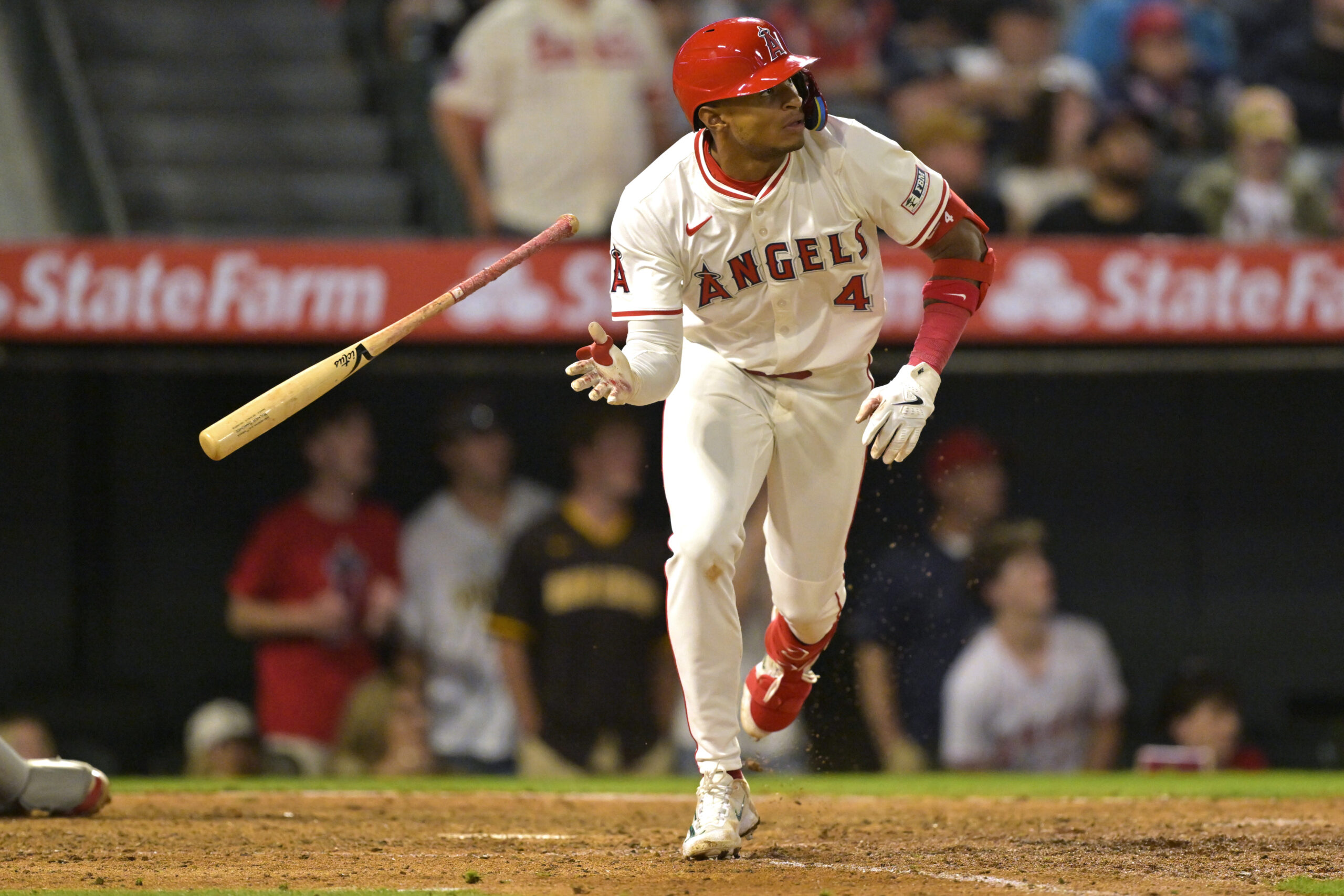 The Angels’ Christian Moore tosses his bat as he watches...