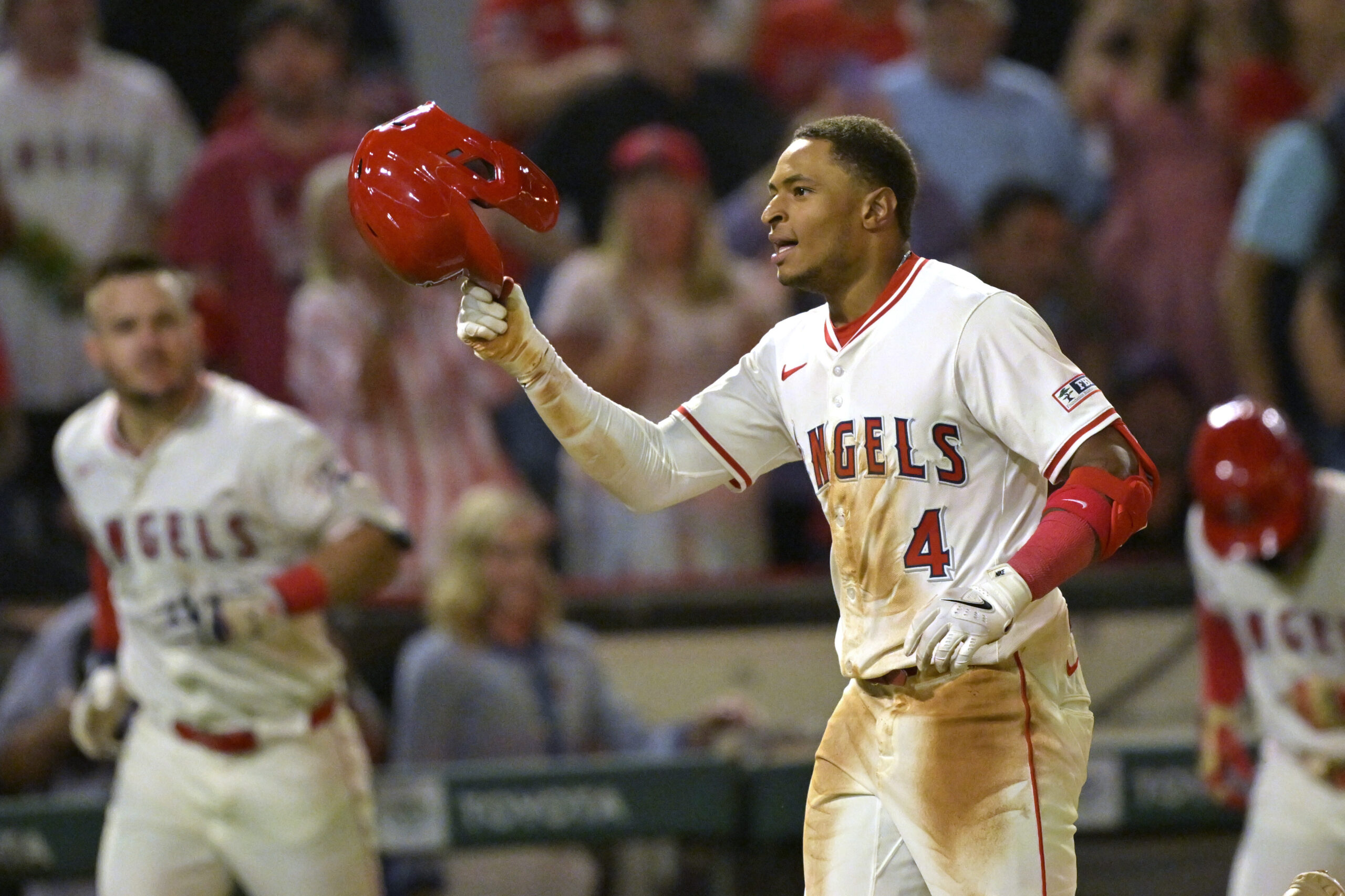 The Angels’ Christian Moore, center, celebrates after hitting a two-run,...