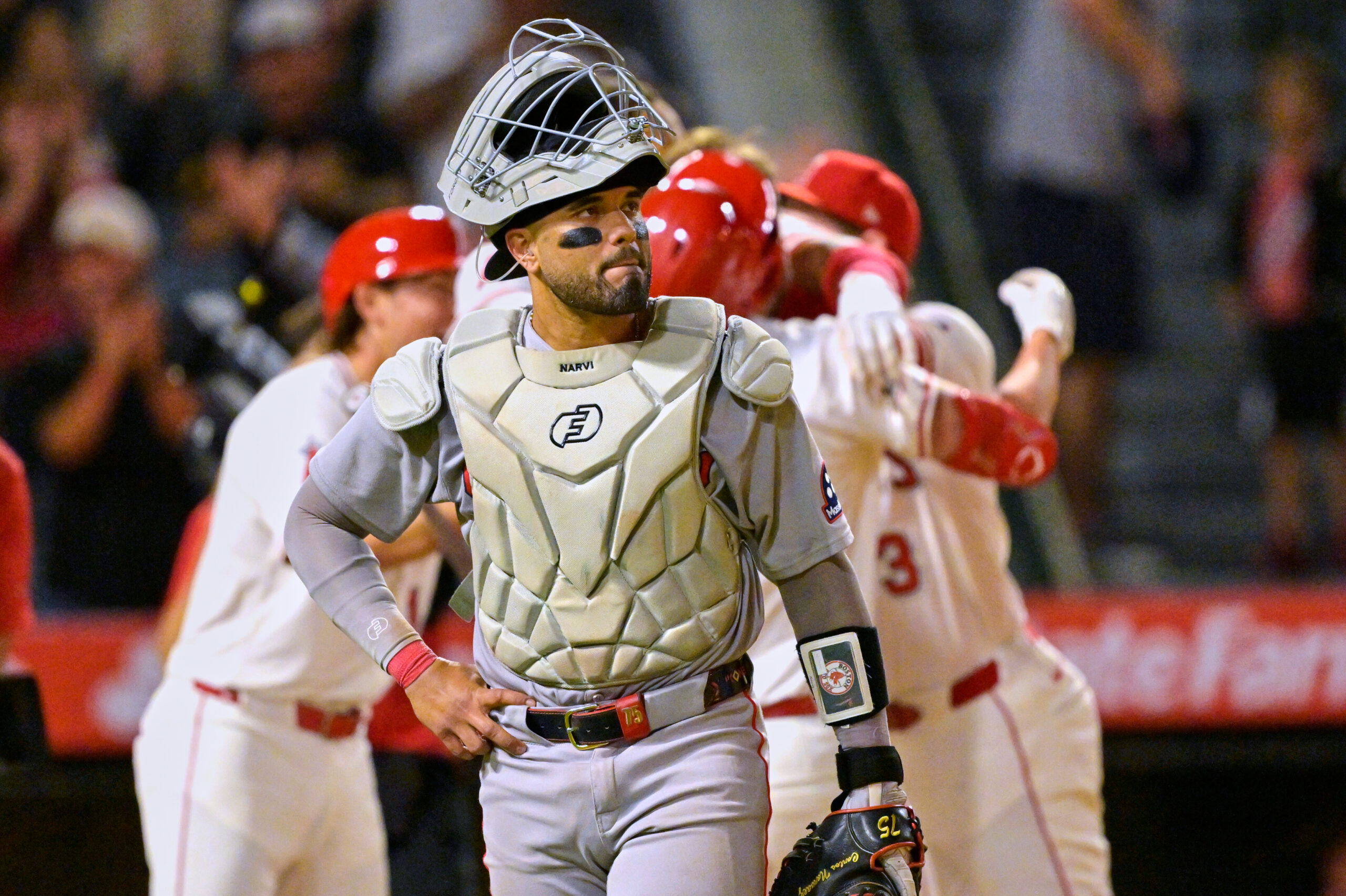 Boston Red Sox catcher Carlos Narvaez walks off the field...