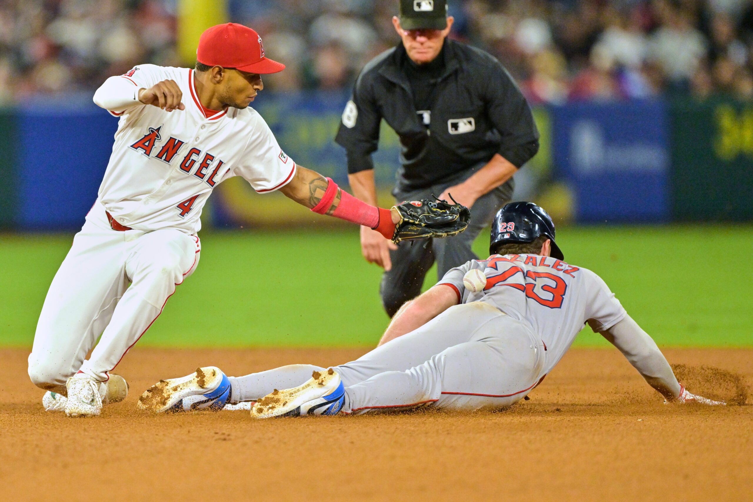 The Boston Red Sox’s Romy Gonzalez is safe with a...