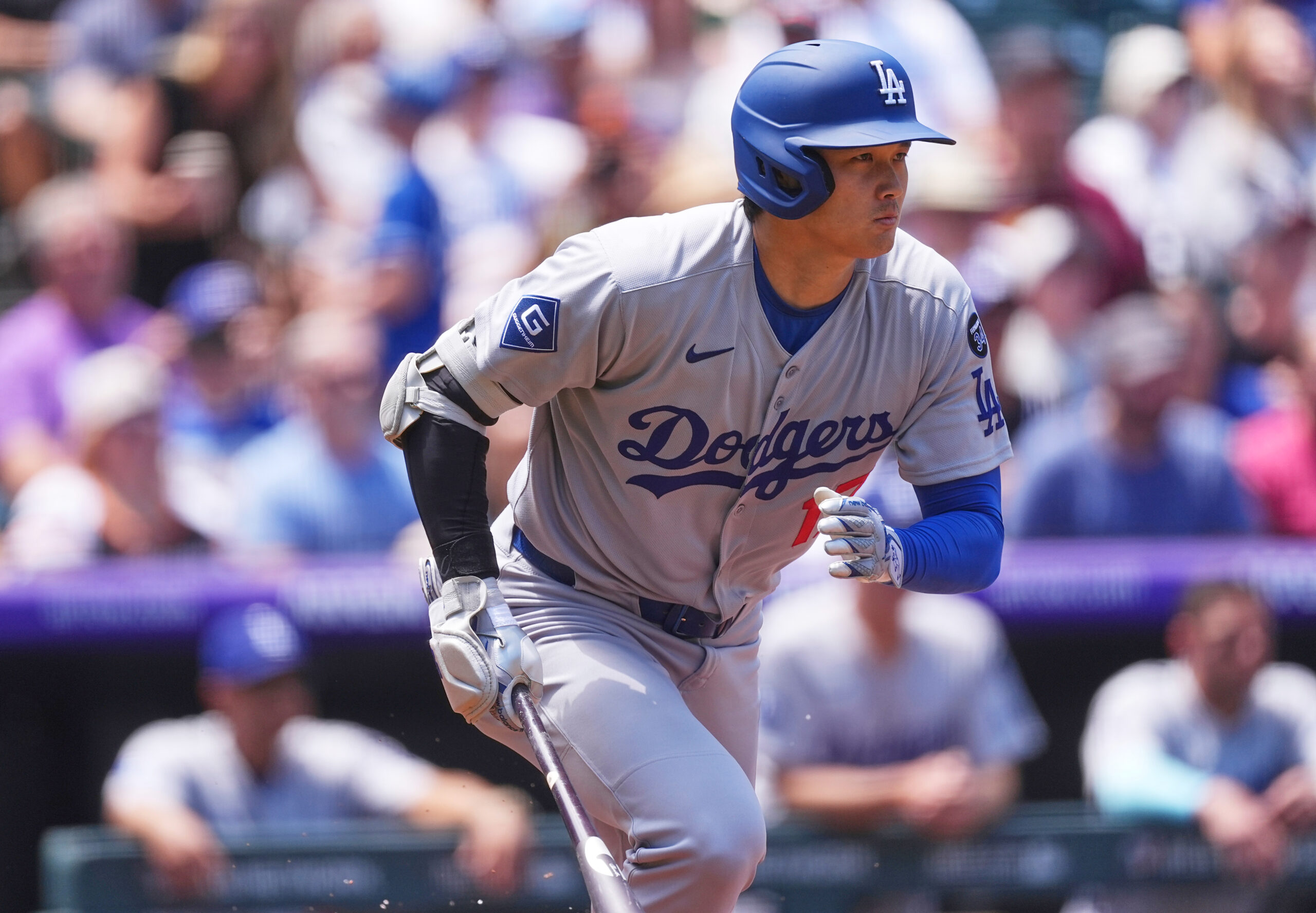 Dodgers star Shohei Ohtani heads up the first-base line after...