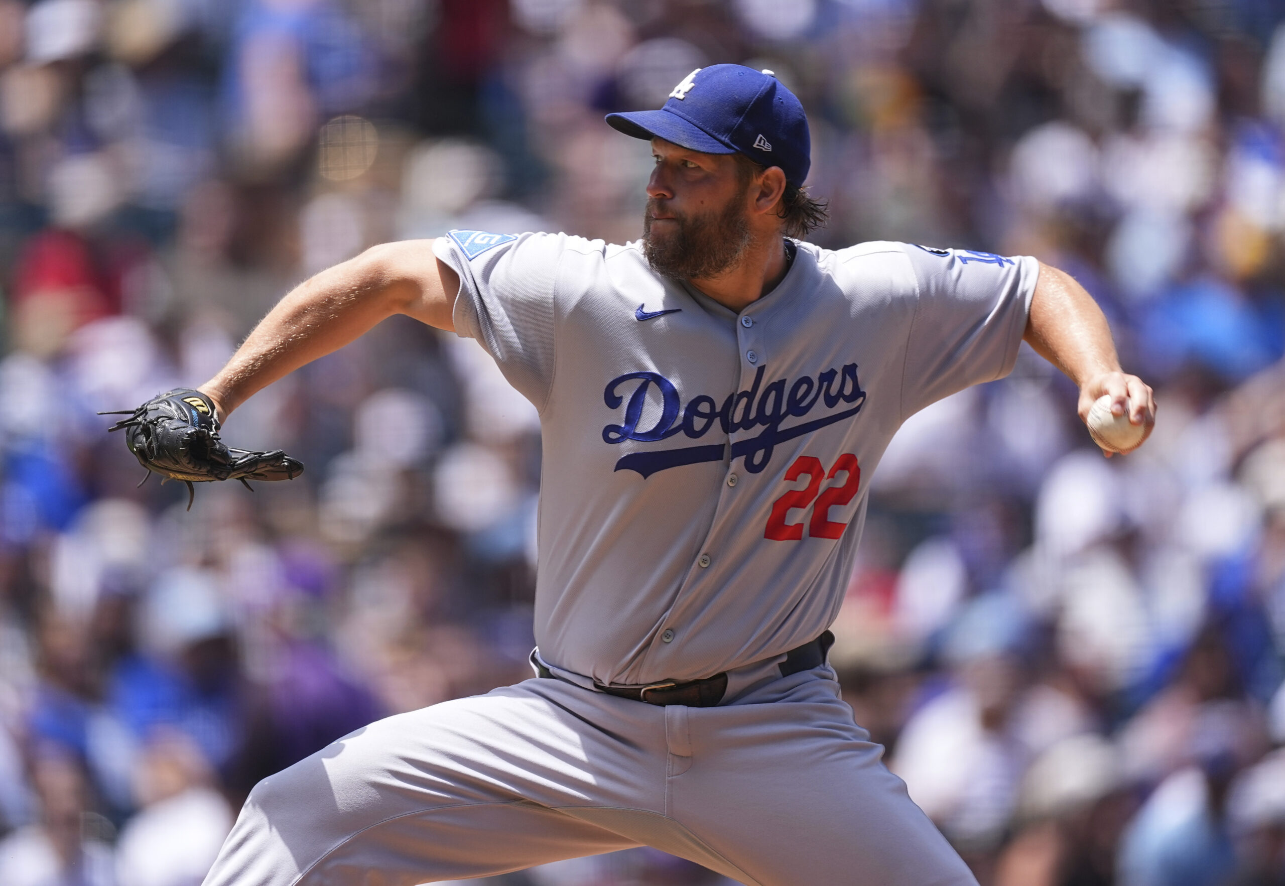 Dodgers starting pitcher Clayton Kershaw throws to the plate during...