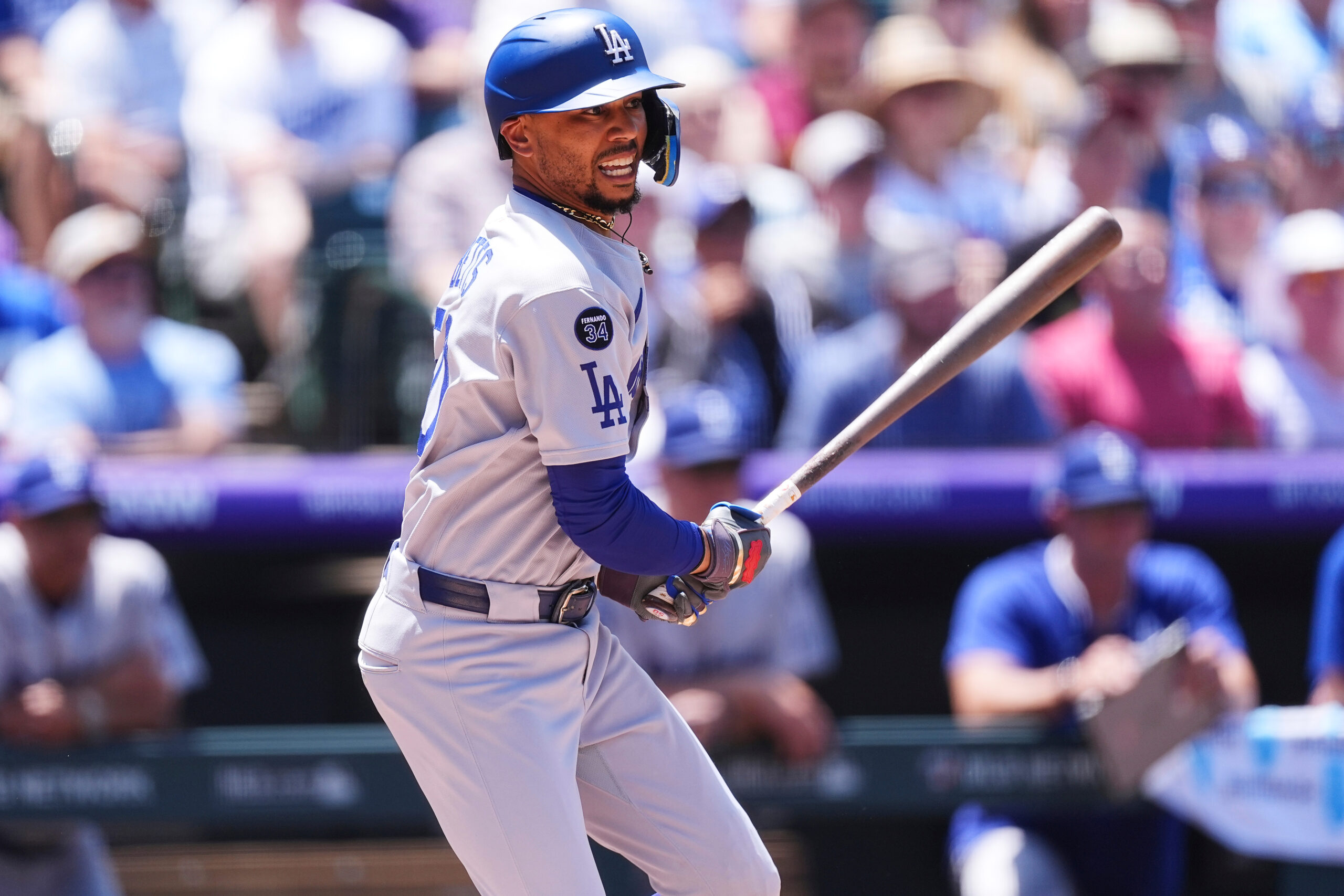 Dodgers star Mookie Betts follows the flight of his RBI...