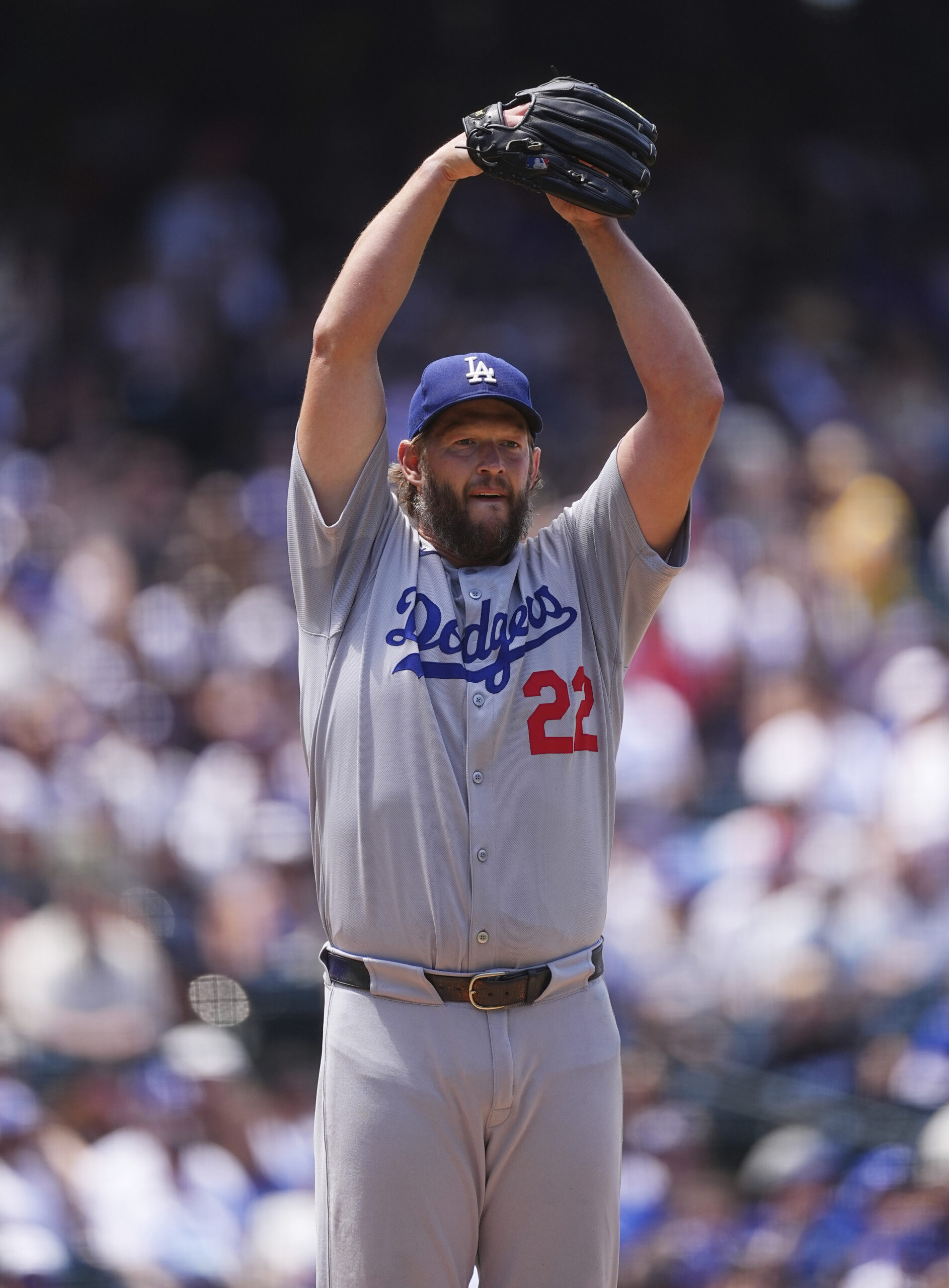 Dodgers starting pitcher Clayton Kershaw goes into the stretch before...