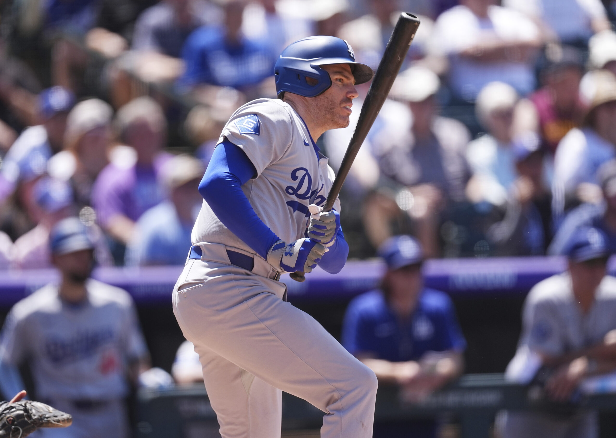 The Dodgers’ Freddie Freeman follows the flight of his RBI...