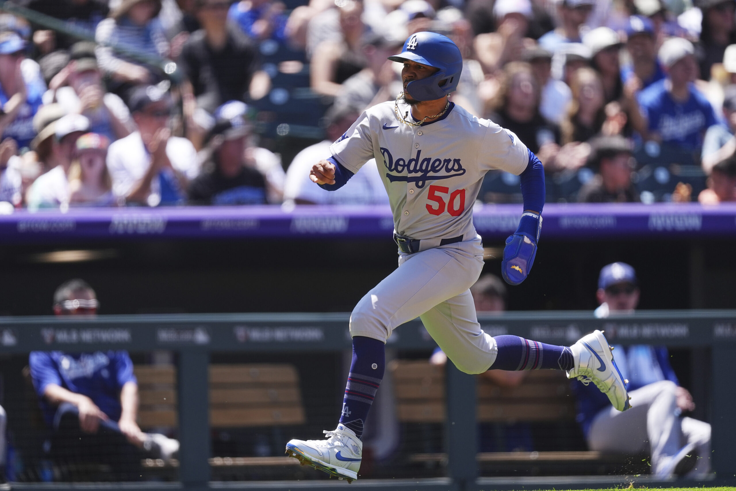 Dodgers star Mookie Betts runs to score on a single...