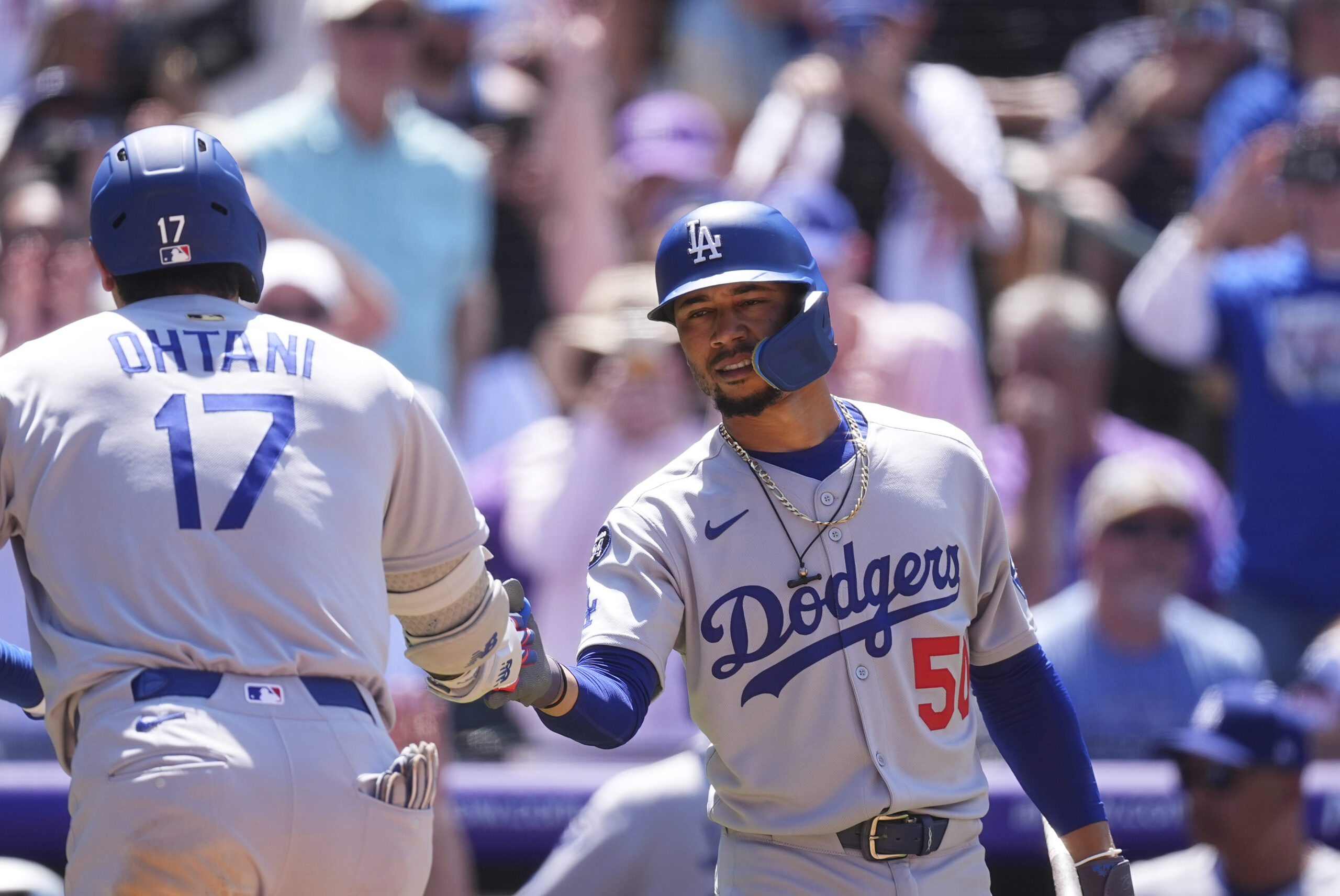 The Dodgers’ Mookie Betts, right, congratulates teammate Shohei Ohtani after...