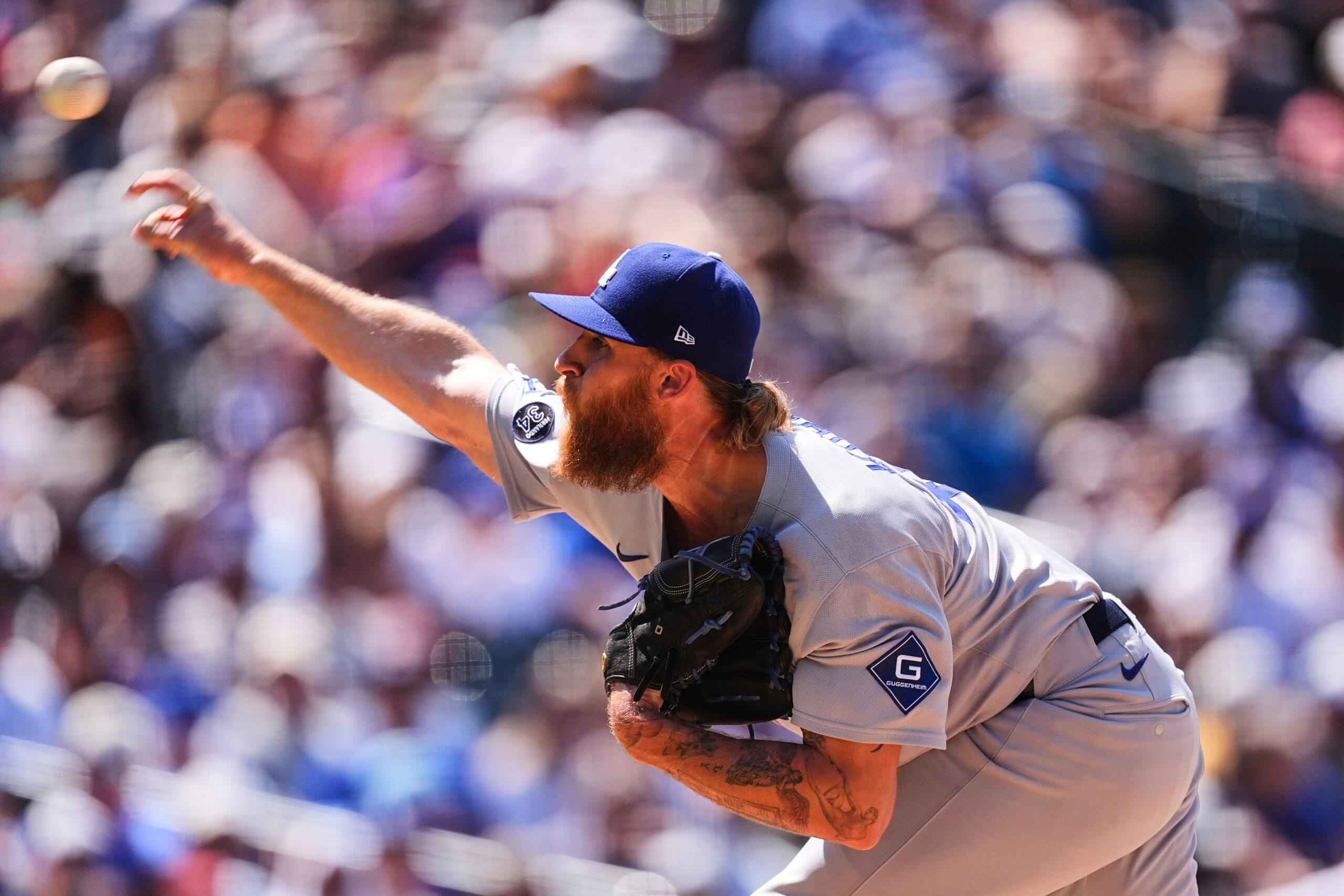 Dodgers relief pitcher Michael Kopech works against the Colorado Rockies...