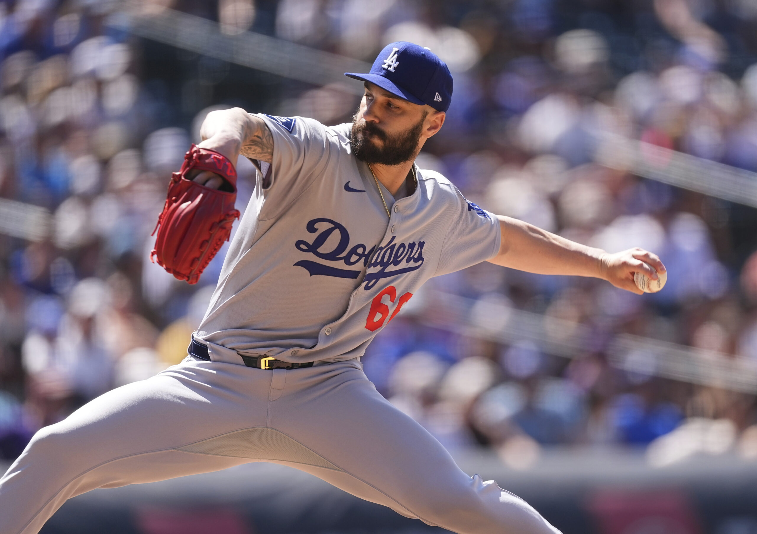 Dodgers relief pitcher Tanner Scott works against the Colorado Rockies...