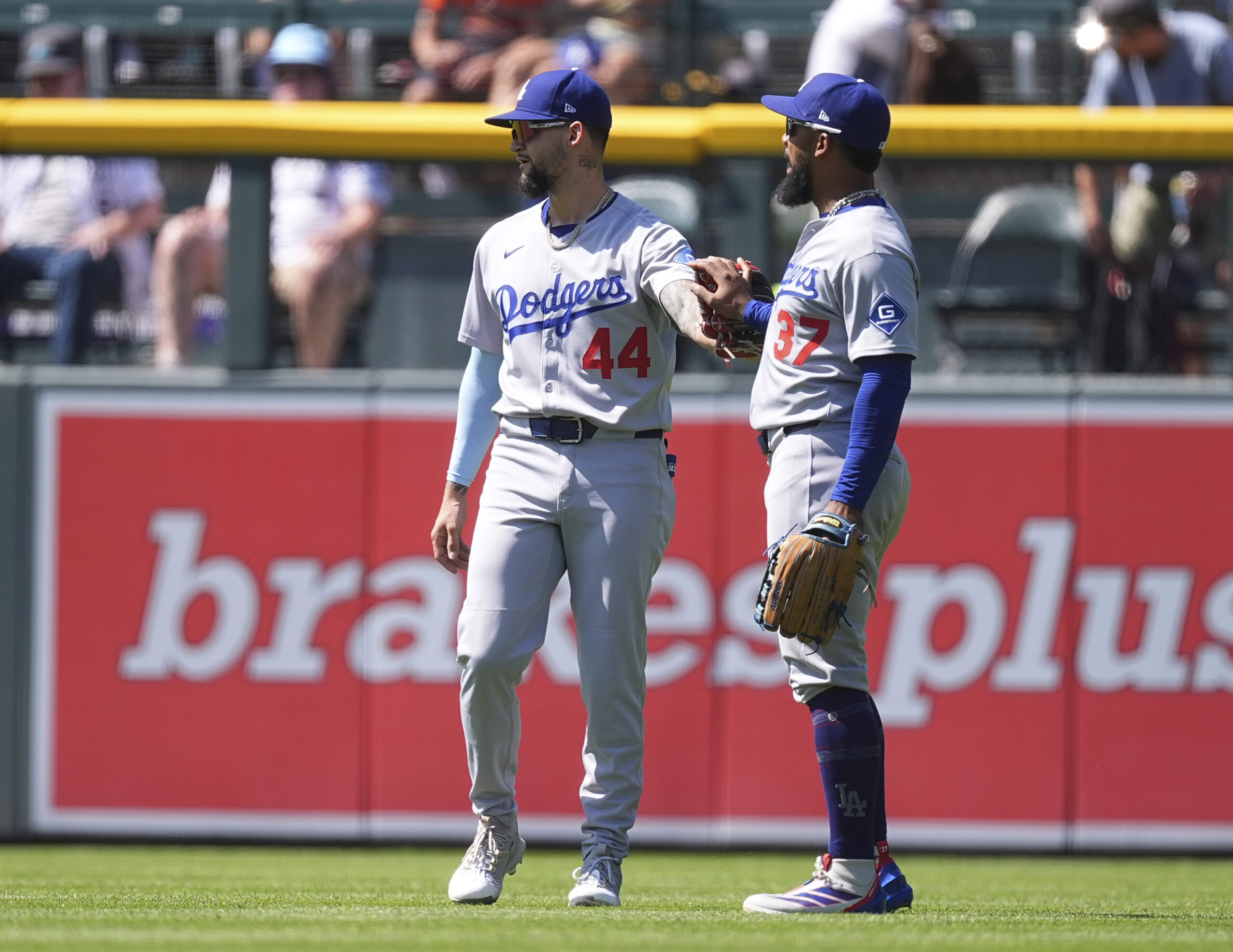 Dodgers right fielder Teoscar Hernández, right, congratulates center fielder Andy...