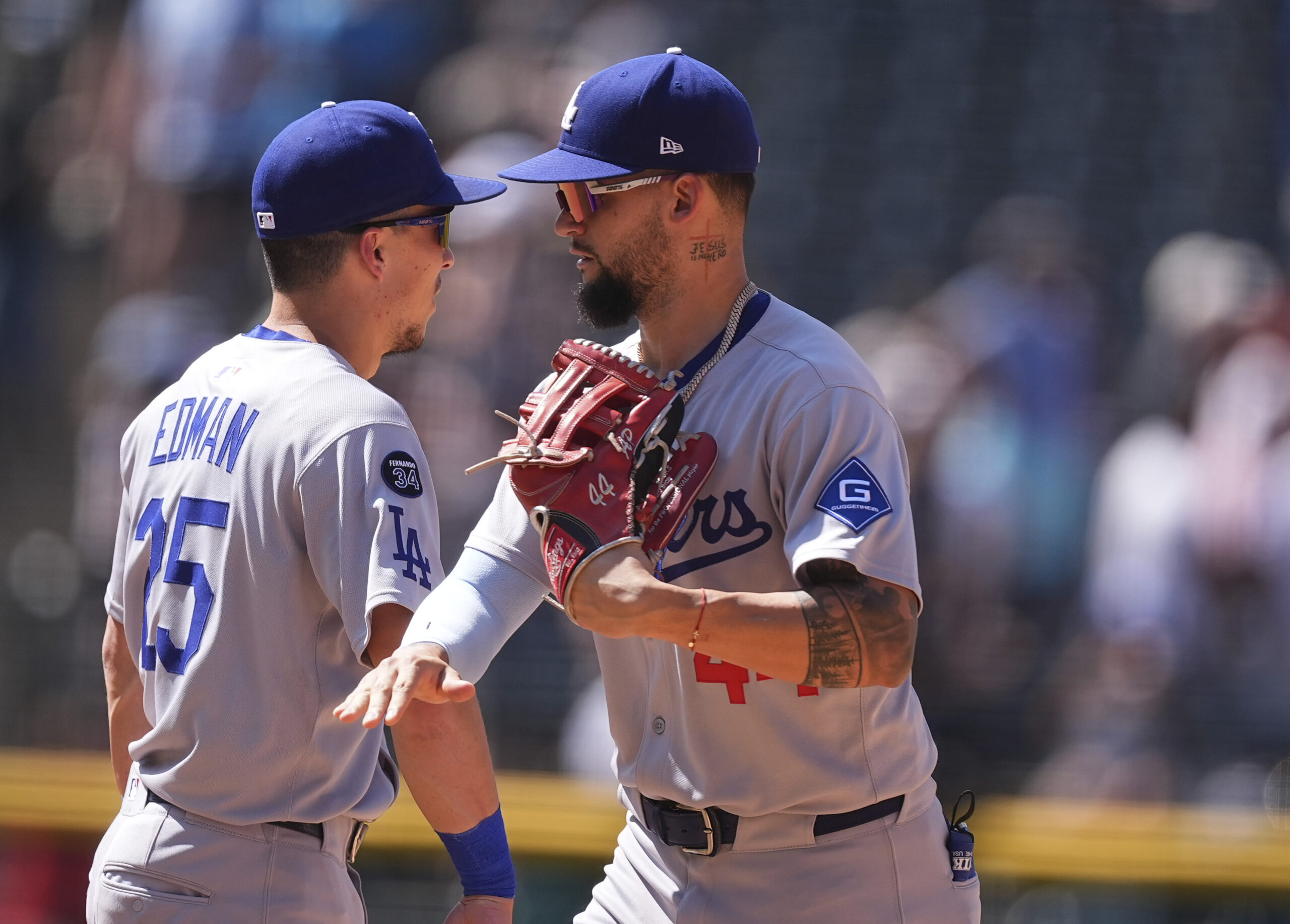 Dodgers center fielder Andy Pages, right, is congratulated by second...