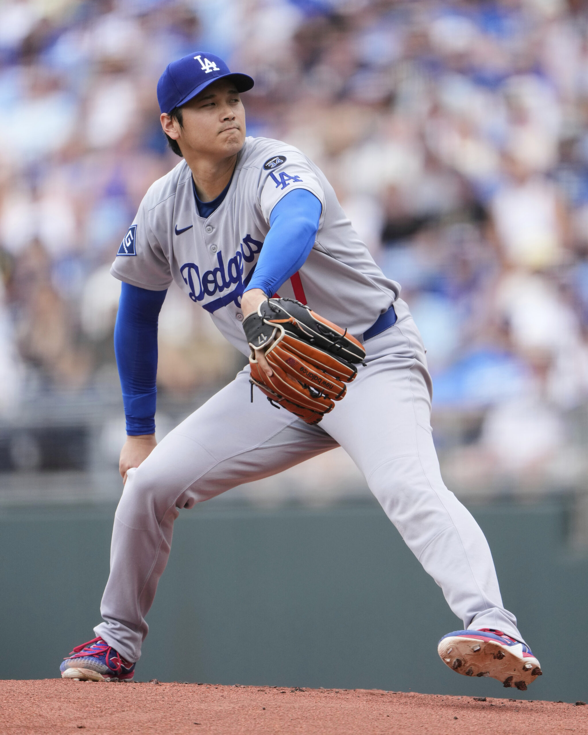 Dodgers starting pitcher Shohei Ohtani throws during the first inning...
