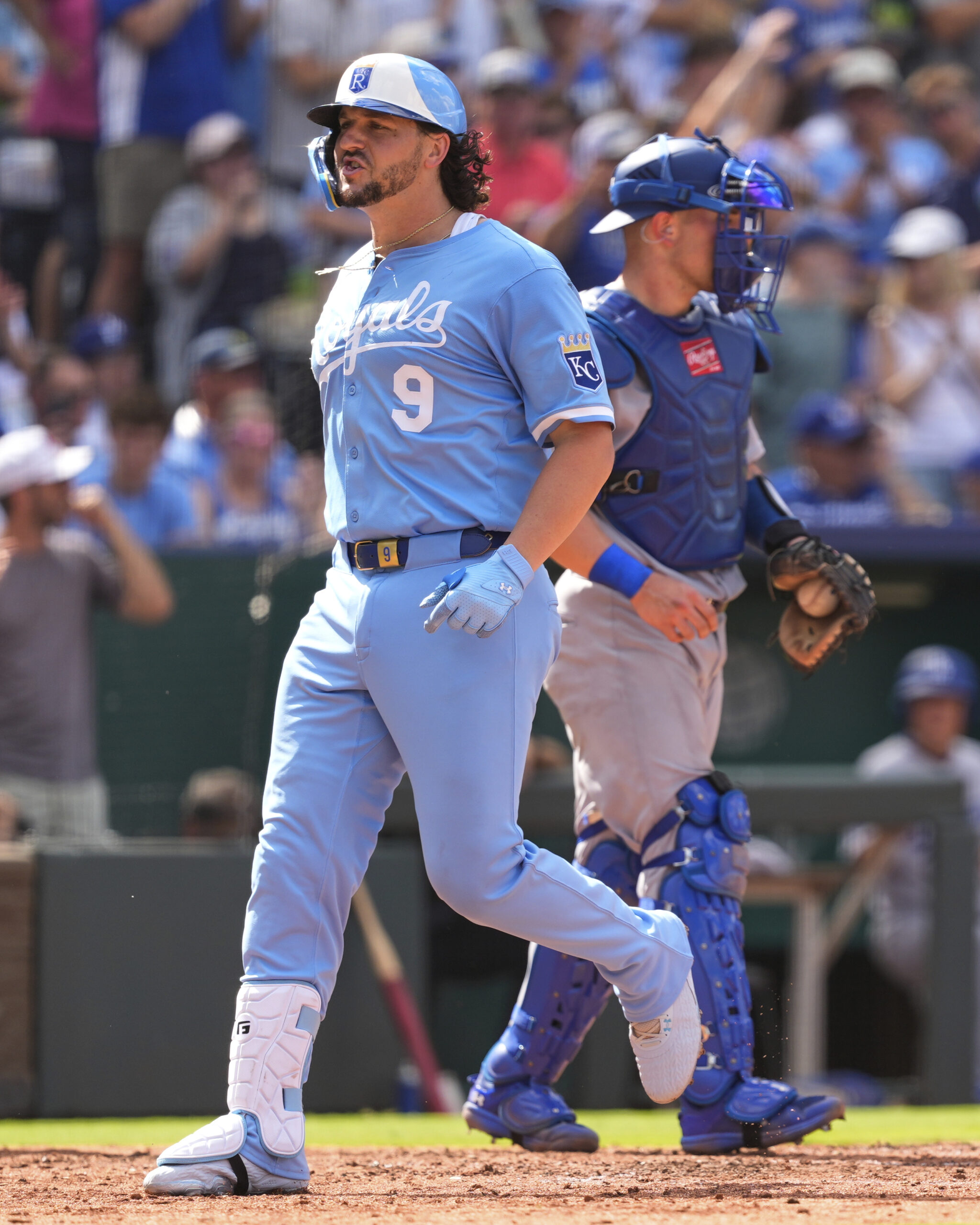 Kansas City Royals’ Vinnie Pasquantino crosses the plate after hitting...