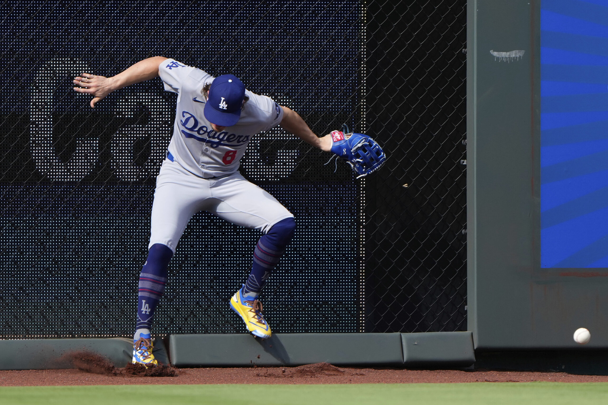 Dodgers first baseman Enrique Hernandez can’t field an RBI double...